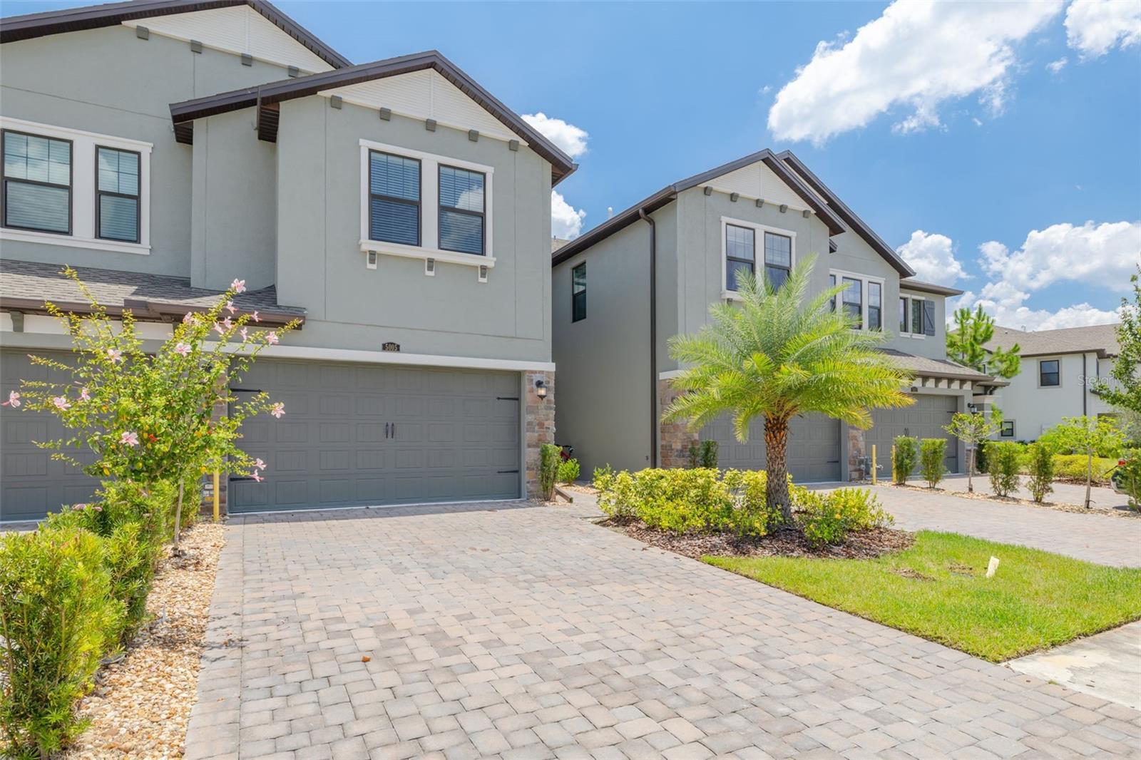 Live where luxury meets lifestyle in this stunning 2023 Sofia townhome, one of the newest constructions in the award-winning Estancia community of Wesley Chapel. This pristine 3-bedroom, 2.5-bath home shows like new and offers 1,827 sq. ft. of thoughtfully designed space with a flexible loft area and oversized 2-car garage with extra storage. From the moment you arrive, thoughtful details shine throughout this open-concept layout that flows seamlessly from the expansive great room to a chef's dream kitchen featuring elegant quartz countertops, a large prep-and-gather island, soft-close cabinetry with pull-out shelving, and premium stainless steel appliances including a gas range with sleek vent hood. Quality upgrades include custom walk-in closet systems, energy-efficient tankless water heater, and WATER SOFTENER system for enhanced comfort. Escape to the tranquil primary suite featuring a spacious layout that easily accommodates a king-size bed, along with a spa-style ensuite bath boasting dual vanities, a generous walk-in shower, private water closet, and an oversized walk-in closet with separate linen closet. Upstairs you'll find two additional well-appointed bedrooms with ample space and a large laundry room for ultimate convenience. Extend your living space to the private covered lanai perfect for morning coffee or evening relaxation, where the seamless flow from kitchen to outdoor space makes entertaining effortless whether hosting intimate gatherings or larger celebrations. Living in Estancia means embracing a vibrant lifestyle with resort-caliber amenities just steps from your door including two stunning pools with heated zero-entry pool featuring lap lanes and slide, state-of-the-art fitness center, luxury clubhouse with community events, tennis and pickleball courts, basketball court, playground, dog park, and 11 miles of scenic walking trails through beautifully landscaped grounds. The HOA handles exterior maintenance, landscaping, irrigation, and roof reserves ensuring truly low-maintenance living so you can focus on enjoying your new lifestyle. Perfectly positioned just minutes from Wiregrass Mall, AdventHealth Wesley Chapel, top-rated schools with bus transportation, and abundant dining options, with easy I-75 access putting you less than 30 minutes to downtown Tampa and within reach of Florida's premier beaches and attractions. This is more than a home, it's your gateway to the best of Florida living in Wesley Chapel's most desirable community. Don't miss this rare opportunity to own one of the newest homes in Estancia at Wiregrass Ranch where luxury meets lifestyle. Schedule your private showing today and discover why this exceptional townhome delivers the perfect blend of modern sophistication, resort-style amenities, and prime location convenience.