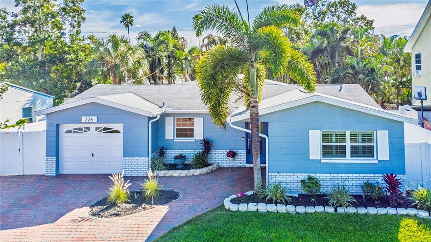 Let’s get this out of the way: the kitchen is the showstopper.
Not “nice for its age.” Not “updated-ish.” A real kitchen.

Granite countertops, classic subway tile backsplash, stainless steel appliances, a large center island with storage on the breakfast-bar side, double convection oven, induction cooktop, and a pot filler right where it belongs. The kitchen opens directly to the dining room because this home understands how people actually live. Truly a chef’s delight, whether you’re cooking for one or entertaining a crowd.

Step from the dining room into the huge living room and you’ll notice a perfectly placed flex space as you enter — ideal for a bar area, reading nook, or display space. It’s a small detail that makes a big difference and keeps the home from feeling cookie-cutter. The living room itself is made for entertaining — game nights, holidays, and everything in between.

Out back is Florida done right: a pool remodeled in 2024 with a spillover spa, new pool pump (2025), paver pool deck, and a gazebo perfect for shaded lounging or evening cocktails. The paver driveway and entrance set the tone before you even walk inside. Move right in and start enjoying it.

The primary suite is generously sized and features an ensuite bath with dual sinks, a walk-in closet with a closet system, and room to unwind. The split bedroom floor plan gives everyone space. One guest bedroom includes dual closets, and there’s also a linen closet and a full built-in storage closet near two of the guest bedrooms. One bedroom is tucked away and ideal for a home office or quiet retreat.
Additional highlights include Plantation shutters throughout, an inside laundry room, garage storage, double-pane windows, and an impact-rated back door.

Major updates are already done:
Roof 2013.
2024: HVAC new + pool remodeled.
2025: kitchen, bathrooms, flooring, interior paint, water heater, appliances, and new pool pump.

This isn’t a “bring your vision” home.
This is a bring your furniture and your swimsuit home.

Easy access to Downtown St. Pete, Tampa, I-275, beaches, restaurants, shopping, and more!