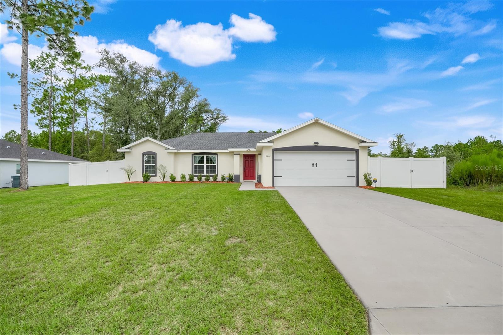 Step into modern living with this 2022-built home offering 3 bedrooms, 2 bathrooms, and nearly 1,600 sq ft of stylish comfort. With no HOA, you get the freedom you’ve been looking for plus a 2-car garage, a 12x29 carport and dual gates (12 ft & 6 ft) giving you plenty of room for all your toys. The interior feels fresh and contemporary, with curtains and blinds included. A Simply Safe alarm system is already in place for peace of mind. Outside you’ll find a huge fenced-in backyard with a pergola and fire pit, ideal for cookouts, gatherings, or nights under the stars. Adventure is right at your doorstep with miles of paved biking trails nearby, plus quick access to Rainbow River and the World Equestrian Center. All your daily conveniences are covered too, with grocery stores and shopping plazas just minutes away. Commuting or day-tripping? You’re set with easy access to I-75: only 1 hour to Orlando, 45 minutes to Gainesville, and 1 hour 30 minutes to Tampa.