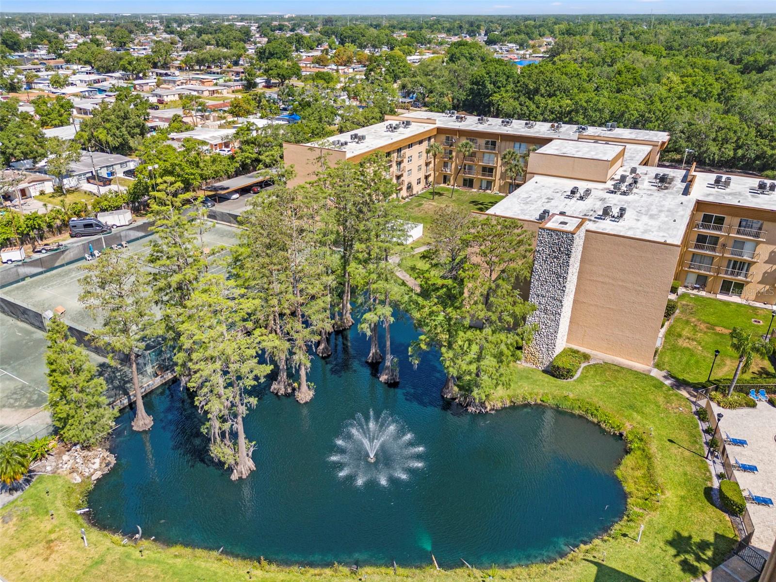Welcome to your perfect Tampa hideaway! This cozy one-bedroom, one-bathroom condo offers 586 square feet of efficiently designed living space that's easy to maintain and perfect for a first-time buyer, down-sizer, or savvy investor. Peace of mind comes standard with this property—it has successfully passed its milestone inspection and structural integrity reserve study and the HVAC system was just replaced, so you can purchase with confidence knowing the building is well-maintained. Step onto your private balcony and enjoy serene views of the tennis courts and tranquil pond—the perfect backdrop for morning coffee or evening relaxation. Inside, you'll find a comfortable living space that maximizes every square foot without sacrificing comfort. Location is truly the star here! Imagine being just minutes from Tampa International Airport—no more stressful rushes to catch flights. Sports enthusiasts will appreciate living near Raymond James Stadium, home of the Tampa Bay Buccaneers. When you're in the mood for outdoor recreation, Al Lopez Park is practically in your backyard, offering walking trails and green spaces. Downtown Tampa is just a short drive away, putting you close to the city's vibrant cultural scene, diverse dining options, and employment centers without the downtown price tag. After a busy day exploring the city, you'll appreciate returning to your peaceful community. The community amenities rival those of high-end resorts. Take a refreshing dip in the swimming pool, challenge friends to a tennis match, or maintain your fitness routine in the well-equipped exercise room. The clubhouse provides additional space for socializing, while poolside grills make outdoor entertaining a breeze. Parking is hassle-free with dedicated spaces, eliminating the stress of finding a spot after a long day. The central location means you're never far from Tampa's best restaurants, shopping, and entertainment venues. Why rent when you can own this low-maintenance home in a prime Tampa location? Your new life of convenience and comfort awaits!