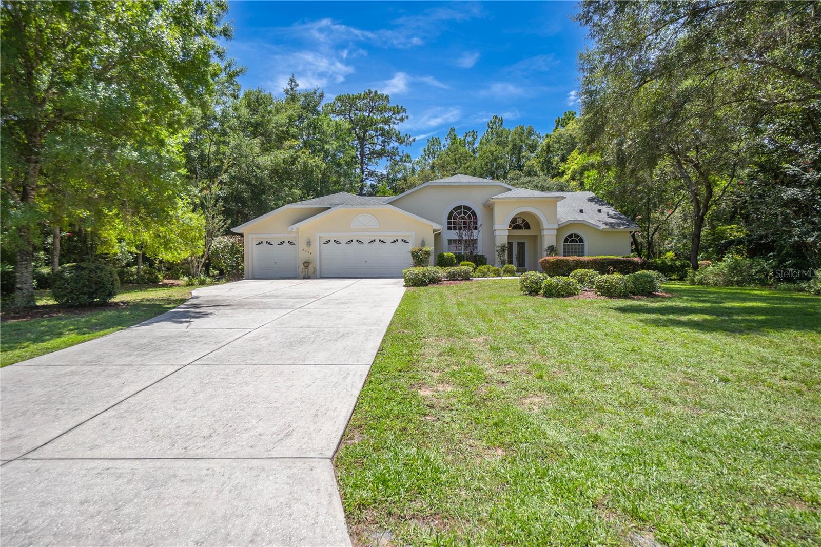 One or more photo(s) has been virtually staged. If your dream home includes a 3 car garage, a pool that says “summer starts now,” and enough space to host a game of hide-and-seek with ten people and still not be found, welcome to your moment. This 3 bedroom, 3 bathroom slice of Pine Ridge sits on a full acre and serves up 2,599 square feet of “oh wow” at every turn. Step through the grand double doors and into a foyer so bright it might require sunglasses. The layout is open, airy, and ready for your furniture to strike a pose. Cathedral ceilings? Check. Oversized windows? Absolutely. The kitchen is a glorious throwback to when cabinets were solid, counters were expansive, and there was room for more than one person to cook without elbowing each other. There’s even a breakfast nook with pool views because why not feel fancy while eating cereal? The primary suite is big enough to practice your cartwheels in and includes a walk-in closet, and a jetted tub. The guest bedrooms are generously sized too, in case your in-laws “accidentally” stay an extra week. Now to the real star of the show: the screened-in pool and patio. Cannonballs, cocktails, or quiet mornings with coffee and birdsong—it’s your call. Plus, you’ve got a yard big enough for a garden, or a fire pit. This house isn’t just a place to live. It’s a place to live a little larger. Come see it for yourself before someone else’s Pinterest board comes to life instead.