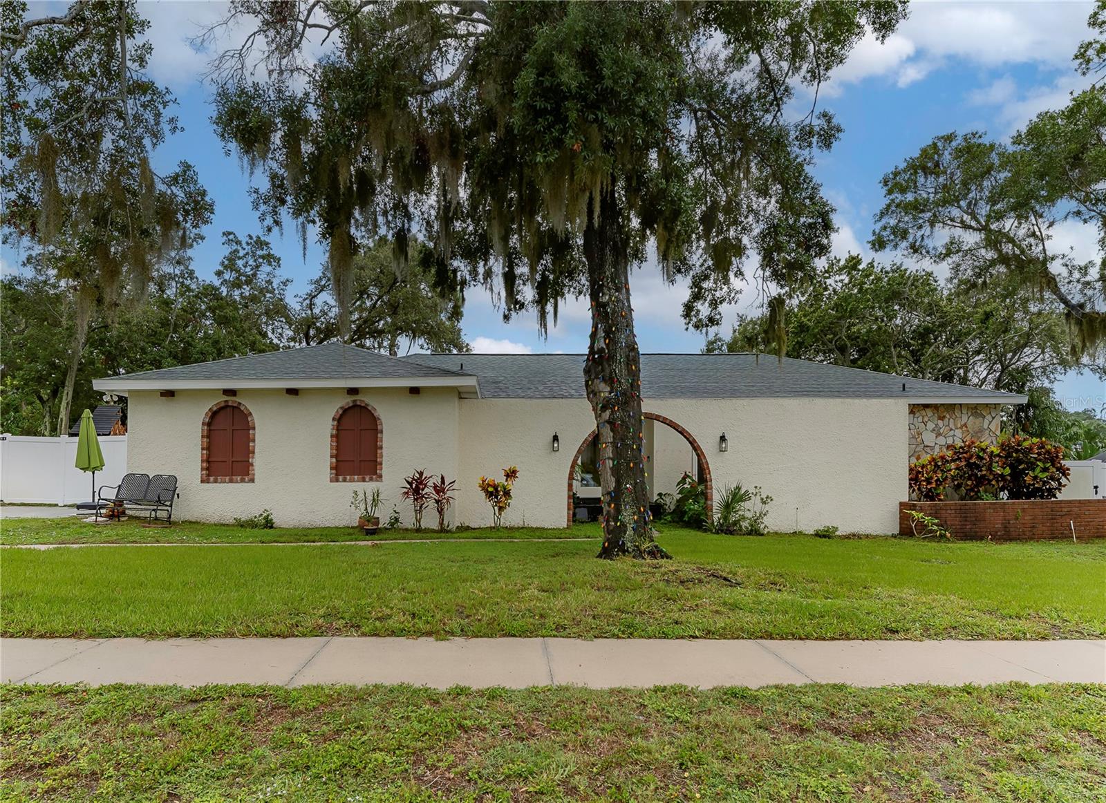Discover your own slice of paradise in beautiful Dunedin, Florida! This whimsical 3-bedroom, 3-bathroom home is nestled in the desirable Spanish Pines neighborhood, just 15 minutes from downtown Dunedin's charming shops and restaurants. The split bedroom plan offers ultimate privacy, with the Primary suite and ensuite bath on one side and the additional 2 bedrooms and hall bath on the other. This home is perfect for young families or those who love to entertain. Imagine relaxing by your private pool, or spending time with friends in your newly updated kitchen furnished with modern stainless appliances and sparkling quartz countertops. With a spacious 2-car garage, tons of additional parking and an ample backyard, this home offers the ideal setting suitable for any jovial occasion. Some additional features include- New roof April 2023, new engineered hardwood flooring throughout, updated electrical and plumbing in the last two years, impact windows, and new insulation and duct work. Don't miss your chance to experience the Dunedin lifestyle!
