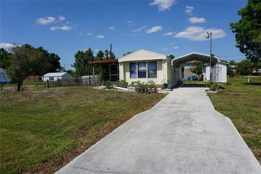 Make this charming retreat your new Southwest Florida address! Located in South Punta Gorda, this very affordable 1985 built manufactured home is move-in ready. ON YOUR OWN LAND AND NO HOA FEES! It features 2 bedrooms and 1 bath, newer flooring, updated kitchen and bathroom cabinets, newer roof (2022) and air conditioner (2025), a carport for covered parking, enclosed lanai/Florida Room that provides extended living space, a storage shed, and fenced yard.  Bring your boat or RV with you. Conveniently located near an I-75 interstate exit and Punta Gorda Airport/Allegiant Airlines, and the property is approximately 30 minutes from Fort Myers – Southwest Florida International Airport. Nearby amenities include golfing, pickleball, downtown Punta Gorda shopping, Fishermen’s Village, farmer’s markets, parks, boat ramps, and a wide variety of restaurants. Put this one on your tour list!