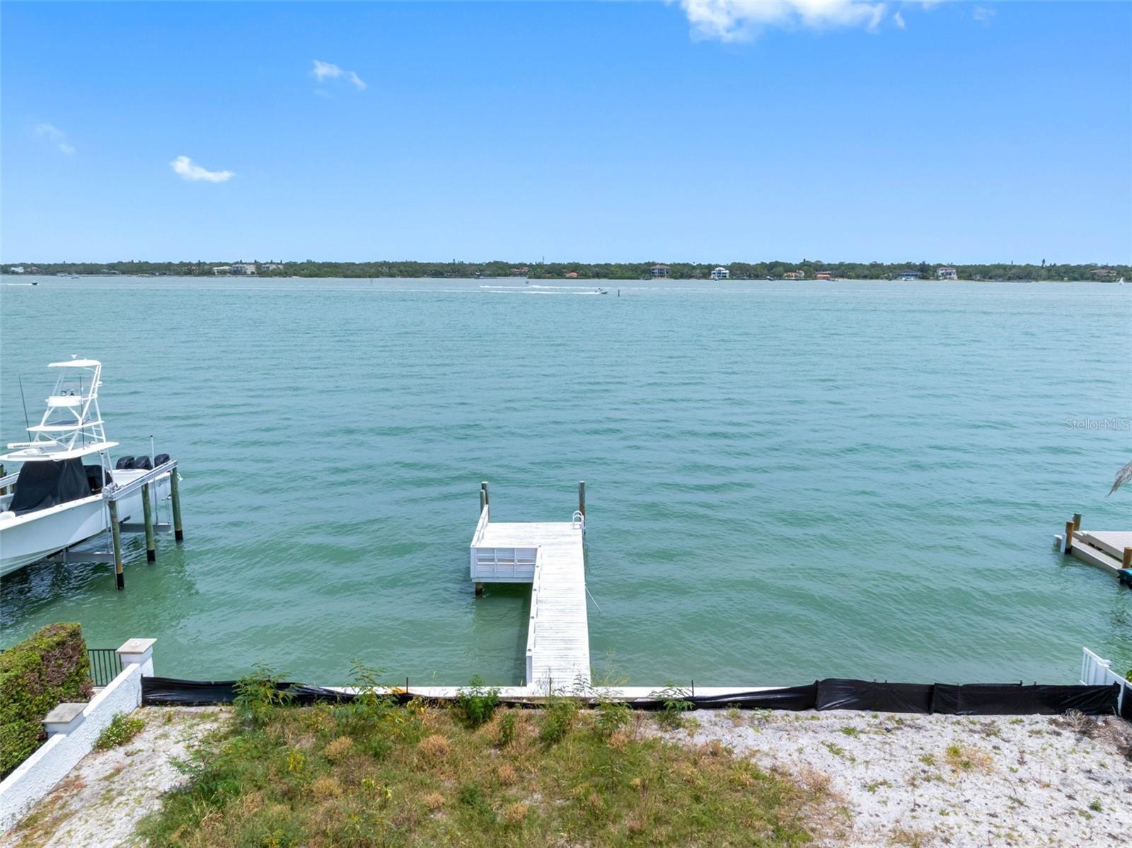 Located on serene 9th Street E in Treasure Island, this expansive parcel offers unparalleled direct bay access, breathtaking open-water vistas, and the potential for a deep-water dock – a boater's haven with unobstructed passage to the Gulf of America. SAIL BOAT WATER! Imagine crafting a luxurious modern residence or a coastal Key West estate; the possibilities are endless in this idyllic setting that perfectly balances peace and serenity on the wide open waters of Boca Ciega Bay! Savor spectacular sunrises over the bay, witness dolphins or manatees gracefully swimming by, or embark on a paddle boarding adventure straight from your backyard. The freedom of no HOA restrictions, building your vision is as flexible as it is effortless. Located just moments away from Treasure Island's pristine sugar, white sand beaches, waterfront dining, and vibrant shopping venues, this is not merely a lot – it's a lifestyle opportunity waiting to be embraced and captured by your dreams! A short drive to downtown St Petersburg for more incredible nightlife and parks or hop on the highway to the International Airport easily in Tampa!