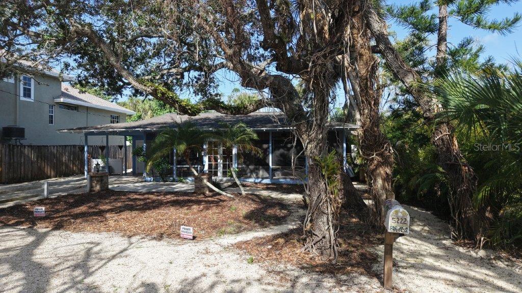 Opportunity knocking loudly! Here it is the least expensive pool home on Siesta Key. You will approach under a charming, canopy lined street. This 2BR/2BA is ready for someone to put their finishing touches on it after hurricane damage. Walls have been removed from 4 ft down, kitchen cabinets and counter removed. Nice Crown molding. Electrical was rewired and raised. Replumbed in 2020. Tankless water heater is 1 year old. A/C was new in 2023. Ductwork was replaced. Great Lap pool has new pool pump. Roof was patched and not leaking. This fabulous quiet location is a half a mile to the #1 Siesta Key Beach, this is your new place in the sun. Island living at its best.