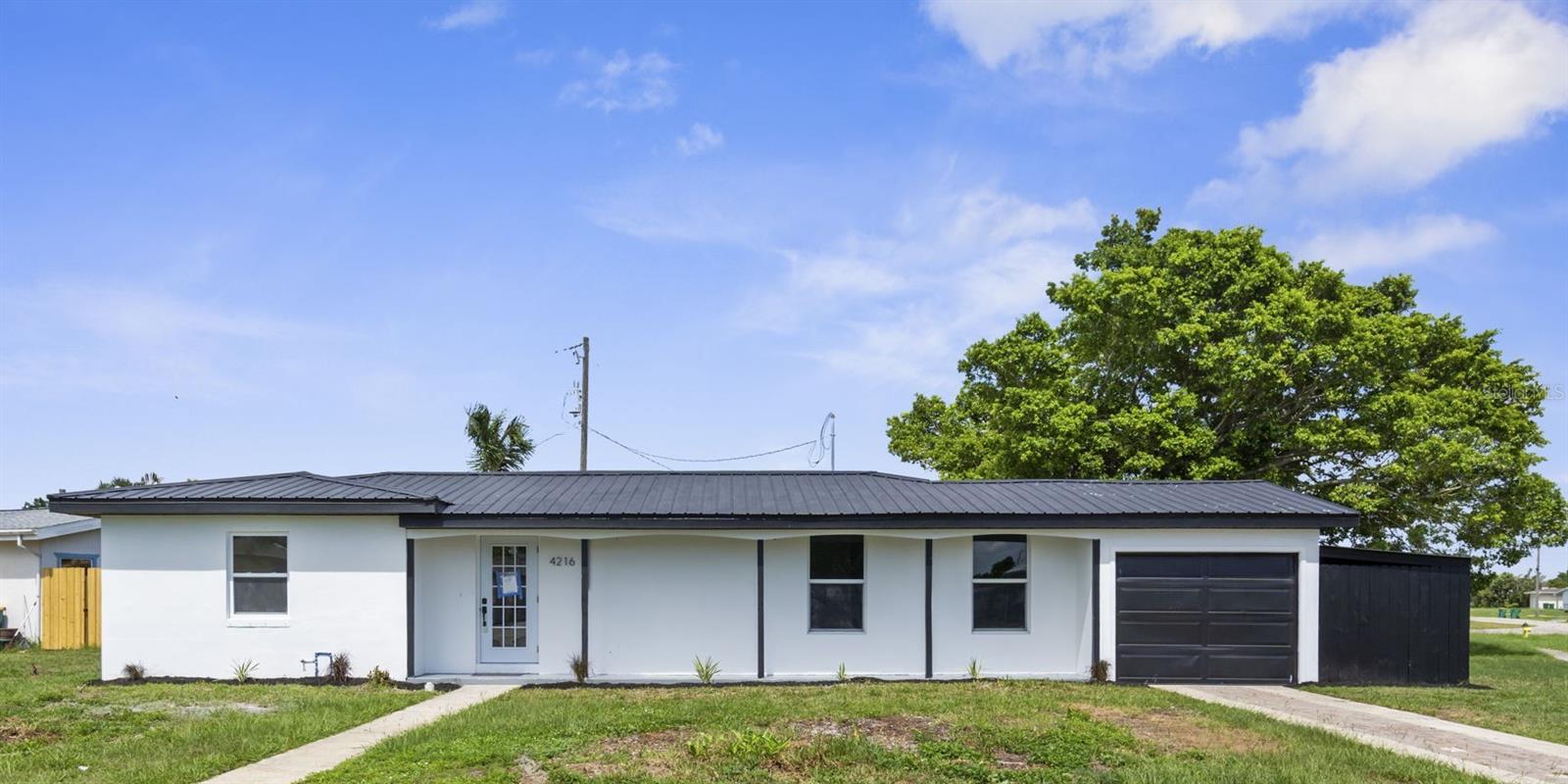 Looking for a move-in ready home near the beach? This freshly renovated THREE bedroom, 1 bathroom home in Port Charlotte is the perfect blend of comfort, style, and laid-back Florida living.
Inside, everything’s brand new — from the ceramic tile flooring (no carpet!) to the shaker cabinets, quartz countertops, and stainless steel appliances in the kitchen. There’s even a cozy eat-in bar that’s perfect for morning coffee or casual dinners.
The entire home has been freshly painted inside and out, and big-ticket updates have already been taken care of: new A/C, new plumbing, new electrical, and a metal roof that’s built to last.
Step out back and enjoy your private yard, now with freshly planted palm trees adding that tropical vibe. Sitting on a corner lot, you’ll have extra space, plus a 1-car garage for storage or parking.
Best part? You’re just minutes from the beaches, shopping, restaurants, and everything else that makes life on the Gulf Coast so relaxing.
Whether you're looking for a full-time home, a weekend getaway, or a smart investment, this one checks all the boxes.