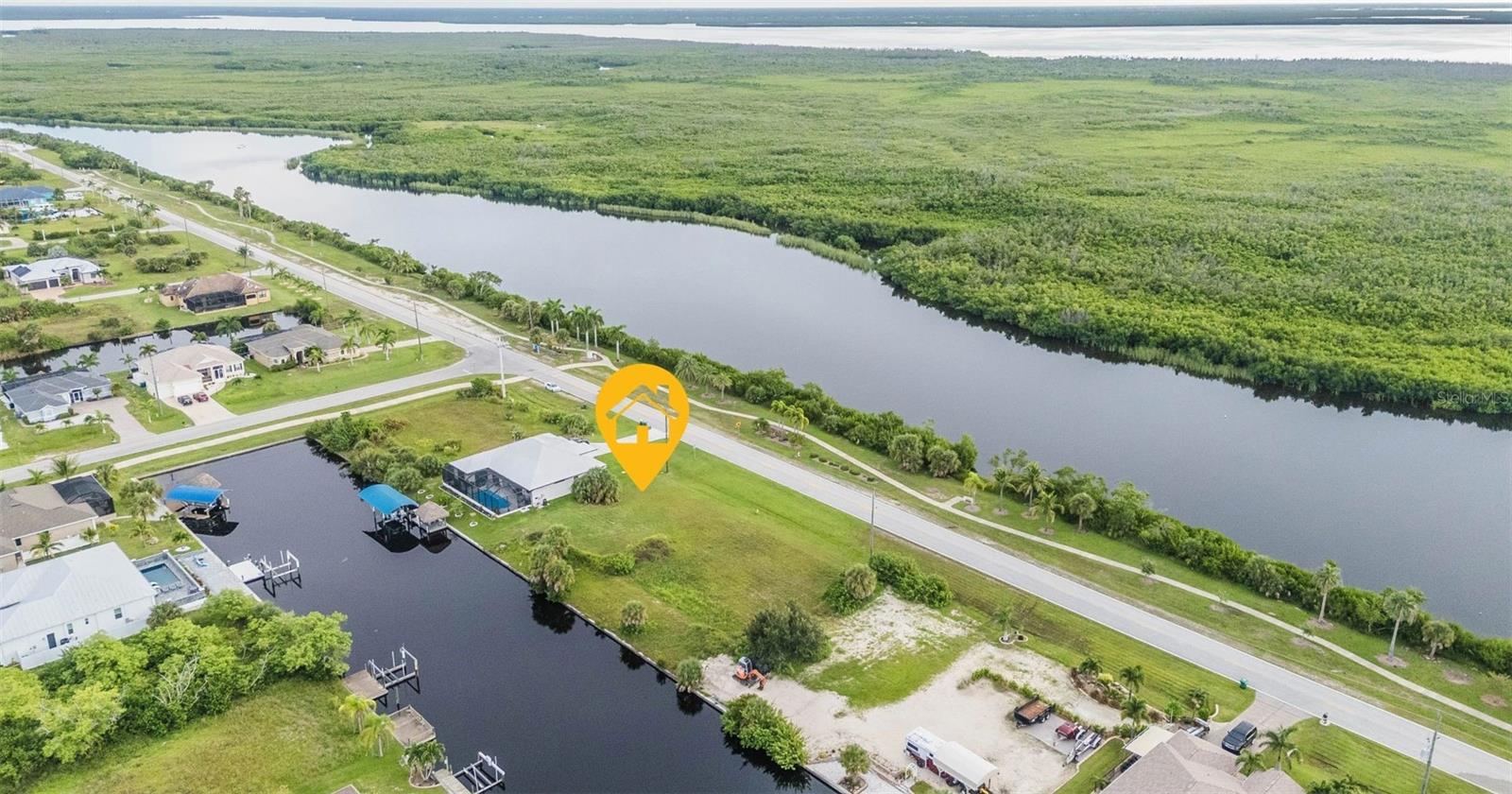 Discover your slice of paradise with this stunning Gulf access waterfront parcel nestled in the highly sought-after boating community of South Gulf Cove. This property features a backyard canal that stretches an impressive 80 feet wide, of concrete seawall. Perfect for docking your boat and enjoying tranquil water views. With public water and sewer services readily available, building your dream home has never been easier. Enjoy the convenience of quick access to the lock, allowing you to set sail to Charlotte Harbor and the Gulf of Mexico in moments. Explore the area's pristine Gulf beaches, a variety of dining options, shopping venues, and numerous golf courses that cater to every enthusiast. Embrace nature with nearby public parks, inviting bike and walking paths, and a picturesque lagoon coupled with a wildlife conservation area just across the street. Plus, don't miss the chance to acquire the adjacent waterfront lot available for sale. Experience the ultimate Florida lifestyle—your waterfront dream awaits!