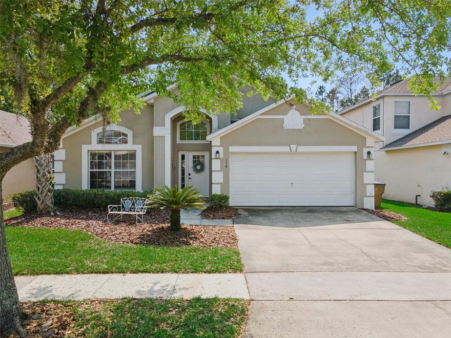 A beautifully furnished 4-bedroom, 3-bathroom pool home with two ensuite bedrooms, set within a guard-gated resort community, offering a tranquil wooded view and a highly sought-after south-facing pool deck bathed in sun all day. From the moment you step inside, the home’s open layout, high ceilings, and abundant natural light create an inviting and spacious feel. At the front of the home, a formal living and dining area with decorative shelving provides a welcoming first impression, while the main living space unfolds toward the rear with a seamless flow between the kitchen, casual dining area, and family room—ideal for both relaxing and entertaining. The remodeled kitchen features granite countertops, modern cabinetry, and a counter-height breakfast bar, all designed to connect effortlessly with the main living areas. Large sliding glass doors from the family room open up to the outdoor space, blending indoor and outdoor living. The primary suite is generously sized and positioned to enjoy views of the pool and conservation. It includes a large closet and a remodeled ensuite bathroom with granite counters, a modern rectangular sink, a separate shower, and a spacious corner soaking tub. A second bedroom also offers its own ensuite bathroom, providing flexibility for guests or strong short-term rental appeal. Two additional themed twin bedrooms share a third updated bathroom, also finished with granite counters and contemporary fixtures. Throughout the home, ceramic tile flooring runs through the main living areas, complemented by laminate wood flooring in the bedrooms, offering both style and durability. Step outside to a spacious south-facing pool deck designed for all-day sunshine—an especially desirable feature for short-term rentals. The outdoor area includes multiple seating spaces, lounge chairs, and a private pool with a bubbling hot tub, all overlooking a peaceful wooded conservation backdrop. The setting is both private and relaxing, with ample deck space for enjoying Florida living year-round. This home is fully furnished and turn-key, making it an excellent opportunity for personal use, a second home, or an income-producing vacation rental. Recent updates provide added confidence and peace of mind, including a roof replaced in 2019, an AC system approximately 5 years old, an electric pool heater installed just 2 years ago, and a washer and dryer also replaced within the last 2 years—helping ensure the home is as functional as it is well presented. Located within Terra Verde Resort, a well-established, guard-gated community known for its amenities, residents and guests enjoy access to a lakefront clubhouse, resort-style pool, fitness center, playground, game room, and sports courts, all just 12 houses down from the property. The location offers outstanding convenience—just minutes to US-192 with its wide array of shopping, dining, and entertainment options. Walt Disney World is only 4 miles away, Universal Studios Florida  35 minutes, and Orlando International Airport is just 25 minutes, making travel and day trips effortless. A standout opportunity in a high-demand resort community—fully furnished, ideally positioned, and ready to perform from day one.