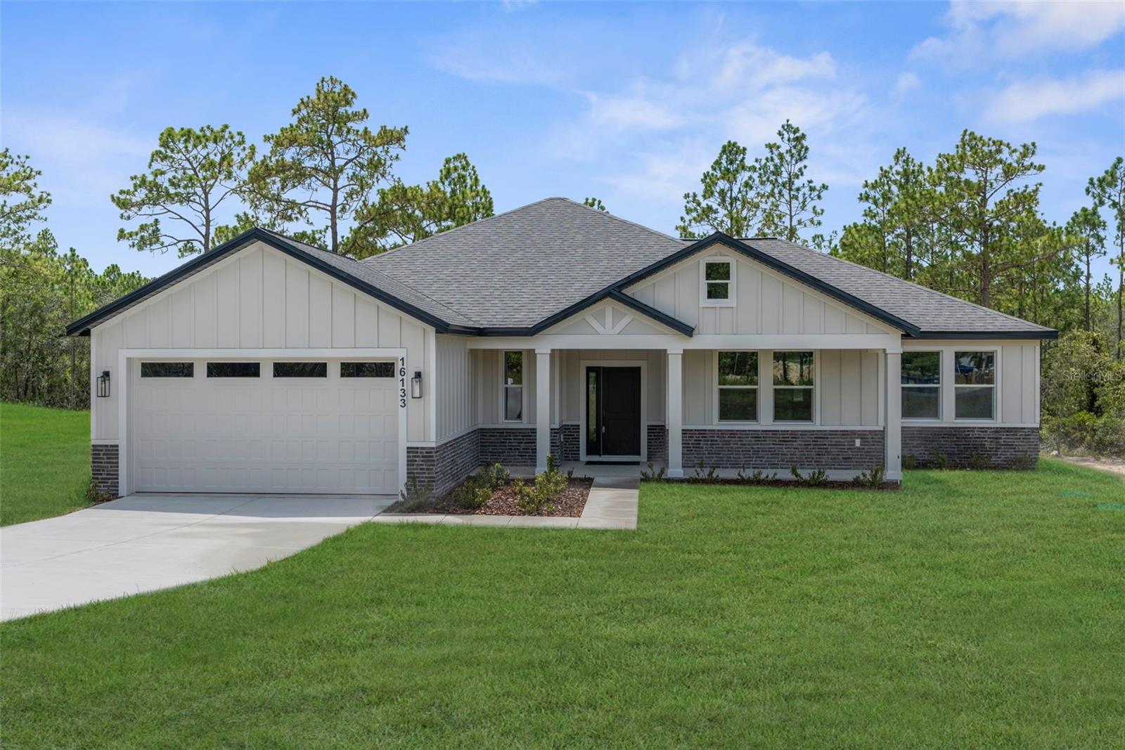 STUNNING...Brand New Craftsman-style Luxury Home!! 4 bed /2.5 baths /2 car garage!! Check out the Builder's Signature Mudroom and Laundry Room in this model!! PAVED ROAD!! NO HOA!! NO FLOOD!! NO REAR NEIGHBORS!! MOVE-IN READY!!! This stunning home offers 4 large bedrooms + 2.5 bathrooms + 2 car-garage! It boasts a beautiful, inviting front porch to decorate for the holidays!! The builder added board and batten on the exterior of the home with stacked stone accents...this all adds to its country appeal...this is NOT your standard basic "Spring Hill stucco home!"
This is a large home with 2,131 sq ft living space; 2,839 total. The entryway & front door welcomes you and your guests into the grand center of the home with a large open great room, island-style kitchen and dining room all with 10' ceilings! The high ceilings and open floor plan makes this home feel spacious, light, bright, and cheery...where your family can gather for years to come!
Every inch of this custom home is upgraded and attention was paid to every inch and every detail including designer faucets and lighting, upgraded baseboards, upgraded windows/sliders, and continuous Luxury Vinyl Plank flooring throughout the entire home (no carpet)! The upgraded kitchen offers stunning QUARTZ countertops with the modern large, single-level island with breakfast bar big enough for the whole family! Real wood upgraded 42'' soft-close cabinets with a stunning backsplash for that finished luxury look and feel. New stainless steel appliances! LARGE WALK-IN PANTRY!
The home has a split floor plan offering privacy to the owner's suite with a large ensuite bathroom! Double doors open up into the private master bedroom with a high tray ceiling and two large walk- in closets! The ensuite bathroom is a SPA RETREAT in itself with a large stand-alone, modern soaking tub, separate over-sized, floor-to-ceiling tiled walk-in shower and designer shower head and frameless glass door, dual granite vanities and dual sinks, matching real wood upgraded cabinets with framed mirrors, designer faucets and lighting, and a separate toilet room for privacy!
There is a half bath off the great room for your guests! On the opposite side of the home are the additional generously-sized bedrooms with a second full bathroom. This is no ordinary second bathroom!! This has dual granite VANITIES and dual sinks...and the toilet and shower are separate, so family members can still use the vanity area while others are showing. GREAT DESIGN!
Sip your coffee on your large back covered patio in the mornings! Multi-zoned sprinkler system & landscaping! Brand NEW well and septic!! Everything is brand new!! Zoned for the county's newest schools Winding Waters K-8 and Weeki Wachee High School!
Built by LDT CONSTRUCTION...an impressive builder with luxury upgrades and design features...all at great prices for you and your family!! BUILDER'S 2/10 WARRANTY!! Quality Custom Builder.Other spec homes available; call for details.
Minutes from shopping, restaurants, movies, schools, Buccaneer Bay Water Park, kayaking the crystal clear Weeki Wachee River, sunsets at Pine Island, boating, fishing, swimming w/the manatees. 1 hr to Tampa & TOP US BEACHES!