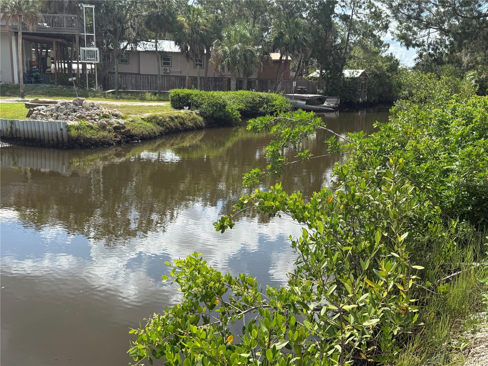 Discover a slice of Old Florida paradise! Located in the heart of Ozello, this rare waterfront opportunity includes two lots with over 100 feet of canal frontage, offering direct access to the beautiful backwaters of the Gulf. Whether you envision a weekend retreat or a full-time residence, this property offers the ideal setting for boating, kayaking, fishing, and soaking up the peaceful coastal lifestyle. A recent survey has been completed, giving you a head start on making your vision a reality. The lots are nestled in a serene and natural setting, just a short ride to the Ozello Marina for easy boat launches and quick trips out to the Gulf. Despite its tucked-away feel, you're only about 15 minutes to downtown Crystal River, where you'll find charming shops, dining, medical facilities, and everyday conveniences, not to mention the chance to swim with manatees in the famous springs! No HOA, just the freedom to create your own coastal haven. Come explore the best of Florida’s Nature Coast!