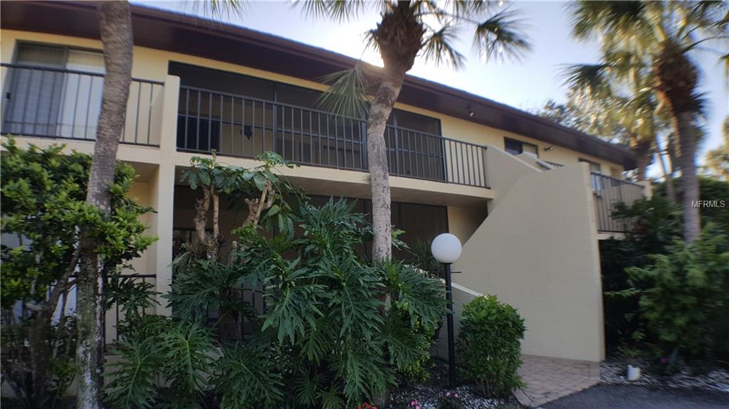 HAS BEEN LEASED THROUGH APRIL, 2025. This delightful second-floor condo is located in the serene community of Wild Oak Bay, nestled along the shores of Sarasota Bay. Enjoy the beauty of the bay area and its abundant natural surroundings. Access to this condo is via stairs leading to the second floor, providing privacy and a sense of elevation. The spacious living and dining area creates a welcoming environment with room for relaxation and entertainment. The kitchen is equipped with granite countertops and comes complete with all essential appliances, including a washer and dryer. Cooking and meal prep will be a breeze. The master bedroom features a luxurious king-sized bed and an ensuite bathroom with a shower. The guest bedroom includes a queen-sized bed and an adjacent bathroom with a tub/shower combination. Enjoy your morning coffee in the glassed-in patio, which overlooks a tranquil pond and the community's heated pool. A covered/open balcony provides additional outdoor space to unwind and there are stairs that take you down for easier access to the yard and lake. The property is surrounded by mature landscaping, creating a peaceful and natural atmosphere. It's a perfect escape from the hustle and bustle of daily life. Residents have access to a heated pool and hot tub, ideal for relaxation and leisure. Take a dip or unwind after a long day. This condo is conveniently located near the IMG Sports Academy and the State College of Florida, making it an ideal residence for all. Enjoy easy access to Bradenton and Sarasota's stunning beaches, where you can soak up the sun, swim in the turquoise waters, and savor the coastal lifestyle. This splendid condo is available for lease. Act quickly to secure this fantastic home.