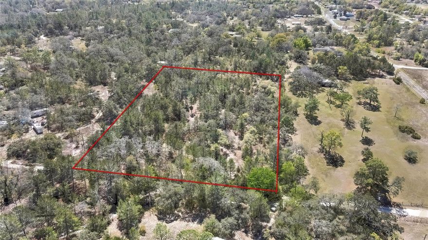 Welcome to your future Oasis! This 4.8 Acre lot is your blank canvas to create the lifestyle you've always dreamed of. Located in the peaceful Potterfield Garden Acres community, this property offers the perfect blend of tranquility, space and convenience. This lot is located minutes away from major highway, shopping, dining and Weeki Wachee Springs, you will have everything you need within reach without sacrificing your privacy. Whether you're looking for serene escape or a place to build your forever home, this lot is ready to welcome your vision. The seller provides the survey. All information should be verified by the buyer or buyer's agent.