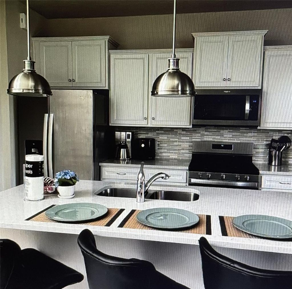 Photo of 7239 Oakmoss Loop, Davenport, FL 33837 (MLS # S5145109)