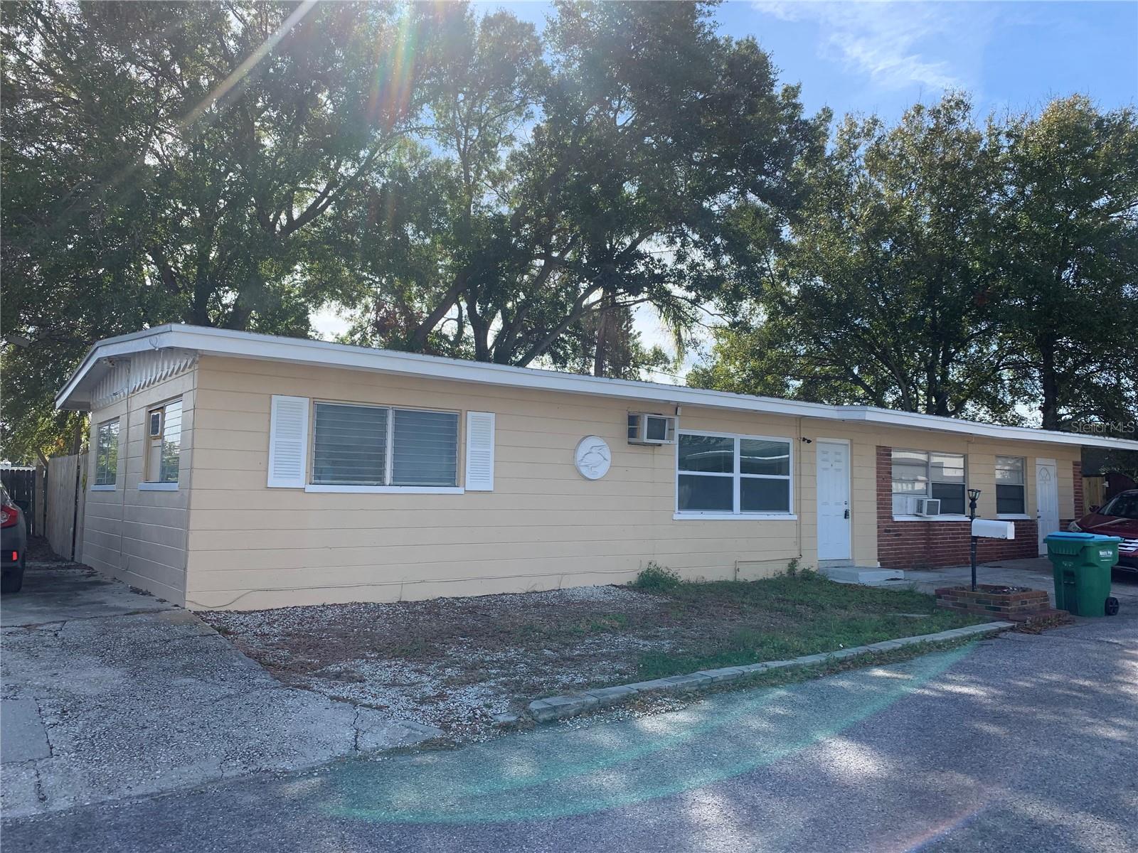 Welcome to beautiful Seminole! This roomy 2 bedroom 1 bath has been renovated and updated! Laminate wood floors throughout. No carpet! Kitchen cabinets freshly painted and new countertops! Located right off Lake Seminole. Good size bedrooms and private fenced in backyard! Off street parking as well! Also features a decorative fireplace and seprate utility Room off kitchen. Water Sewer Trash all included in rent. Small pets allowed.