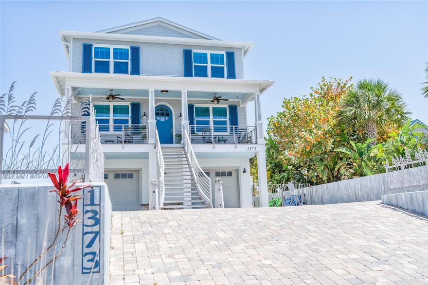 Welcome to a coastal sanctuary unlike any other—a stunning architectural achievement located directly Oceanfront in the highly sought-after North Beach section of New Smyrna Beach, Florida. Thoughtfully crafted to blend cutting-edge technology with timeless elegance, this 5-bedroom, 5.5-bath estate offers the ultimate in luxury, privacy, and beachfront living.  This property is 22 feet at slab on grade, this home has remained untouched by flooding through even the strongest storms—testament to its resilient design and engineering. Encircled by a 10-foot-deep concrete retaining wall and adorned with a custom, artist-designed laser-cut aluminum fence and gates, the property exudes both strength and beauty. Step inside and experience seamless whole-house automation through the Control 4 system, giving you effortless command over lighting, audio, and security. A culinary dream, the state-of-the-art kitchen features top-tier appliances, including a double-wide glass-front Sub-Zero refrigerator/freezer, Wolf 46” gas range, double Wolf ovens, Wolf microwave, two Asko dishwashers, and a Sub-Zero wine and beverage cooler. Custom cabinetry, quartz countertops, and a spacious pantry complete this gourmet space. Each of the five bedrooms is an elegant retreat, with custom closets throughout, blackout-backed designer drapes, and spa-inspired en-suites, including a marble-clad primary bathroom and three additional guest bathrooms finished in marble. The master suite also offers dual custom walk-in closets for refined organization. Entertainment continues outdoors with a fully equipped summer kitchen, boasting a 46” Alfresco gas grill, two beverage refrigerators, granite countertops, and drink rails—ideal for alfresco dining beside the saltwater pool and hot tub, both heated by a new gas heater (2024). The pool features UV sanitation and is surrounded by a fully tiled back porch. Additional highlights include a private 250-foot dune walkover to the beach, whole-house reverse osmosis water filtration, in-wall pest control system (with exterior access port—technicians never need to enter), whole-house generator, elevator, new roof (2023), and four brand-new A/C systems (2025). The home also includes two laundry areas—a cabana-level laundry room and an additional washer/dryer on the third floor. From the hurricane-rated front door to the elegantly appointed interiors and custom features throughout, every detail of this property has been curated for comfort, resilience, and refined coastal living. Located just one mile from Flagler Avenue’s vibrant shopping and dining and one mile from Smyrna Dunes Park and Dog Beach, this estate offers both seclusion and accessibility—the very best of beachside living. Don’t miss this once-in-a-lifetime opportunity to own a true oceanfront masterpiece. Schedule your private tour today.