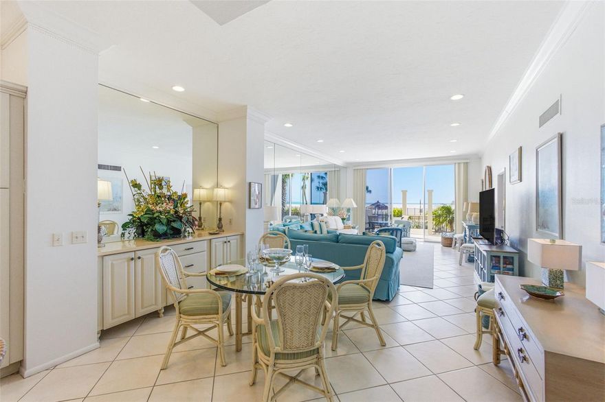 Welcome to Lido Beach Club #102, motivated seller bring offers! Only two units in this complex are beachfront on the first floor. There are no lobby or elevator hassles for this unit. Lido Beach Club condo buiding is one of three complexes on Lido Beach that did not have flooding. This first-floor private gulf-front two-bedroom, two-bath Beach home condo is where luxury meets coastal tranquility. This condo offers an unparalleled walkout to your lanai, blending the beach lifestyle with elegance, comfort, and breathtaking waterfront views.  Fresh paint hues, high 10-foot ceilings in great rooms and bedrooms, and a massive mirrored wall accentuate the high-end finishes in turquoise, blues, greens, and beige, creating a coastal charm decor.  Light dances through the large lanai and master bedroom sliders out to the lower pool deck and beach. From the pillow-tile kitchen backsplash and all new GE Profile appliances, including a 5-burner cooktop and single oven, #102 is turnkey furnished; check out the inventory list with three newer Samsung televisions and a multitude of accessories! If you wish to use this property as a residence or an investment, it embodies a formula of coastal elegance. The Rental of this property has been solid through most of the fall and spring seasons.  Henredon and Martha Stewart master bedroom furnishings, a scattering of Annie Selke throw rugs, luxe upholstery, two new full beds and chests in the guest room, and a newly remodeled guest bath captivate the decor. Expansive light-filled sliders in the Living and Master bedroom invite you to enjoy the heated Gulf-front pool with private beach access. Your sizable private porch features dining and two sunbathing chaises, perfect for unwinding, watching a spectacular sunset, or enjoying your morning coffee.  LBC features a fitness room with a sauna to support a healthy and fit lifestyle, a community room equipped with a full kitchen adjacent to the main lobby, and a beachfront grilling area. Lido Key Park is not far off, featuring bike trails and a kayaking area through mangroves. On the North side of the key, an Olympic-sized pool and the Lido Key Blue Pavilion complex are located. Next door to LBC is the Ritz-Carlton Beach Club with a beach bar, and it's a mere 1.2 miles to St. Armands Circle's restaurants, boutiques, and cultural events. Lido Beach Club has the Milestone report, on-site management, and secure entry to the building and the beach. This community is more than just a place to live; it's a place to thrive! Here, the beauty of the Gulf of America becomes an extension of your home, and every day is a celebration of effortless coastal luxury.