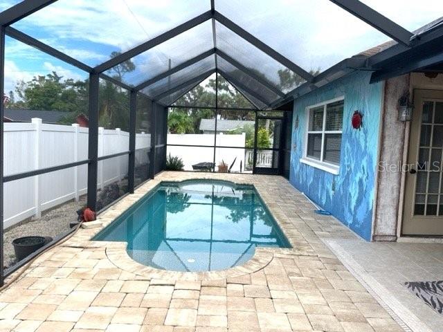 Annual Pet Friendly Rental Available! Beautiful 3 bedroom Pool Home located in South Venice available for ANNUAL RENT. This home is located on a corner lot and has plenty of room to park your R.V. or Boat. The 2 car garage features a kayak or boat pulley storage. The primary suite is spacious and the ensuite has been nicely updated. The two other bedrooms share the beautifully remodeled bath which now included a soaking tub! The kitchen features stainless steel appliances, a breakfast bar and plenty of cabinets and counter space- perfect for entertaining or just everyday living. The large pavered screened in lanai is also a great space for entertaining and comes fully equipped with an outdoor kitchen, grill with a side burner, refrigerator, sink, and a mounted TV, just a great space for gathering around the Saltwater Pool. Out back you will also find a large, Insulated “She Shed” equipped with Electric and Air Conditioning! This would make for a great workout space, home office, craft room, the possibilities are endless! This home has so many wonderful upgrades and features including a Reverse Osmosis water filtration and well water with softener (no water bill!), brand new HE washer & dryer, corner Lot with a fenced yard, extra side stone drive for parking an RV or Boat, additional crewed in outdoor meditation area, an tons of fruit trees- pineapple plants, papaya, passion fruit vine, 3 mango trees and is in the perfect location! Close proximity to Shamrock Park, South Venice Ferry and the Community Boat Ramp. Also, plenty of shopping and dining options nearby and a short drive to Venice Beach and Nokomis Beach. First and security due and a $35.00 monthly resident benefit fee will be applied. Dogs okay, monthly fee will apply. This home is zoned for Venice Elementary, Venice Middle and Venice High Schools!