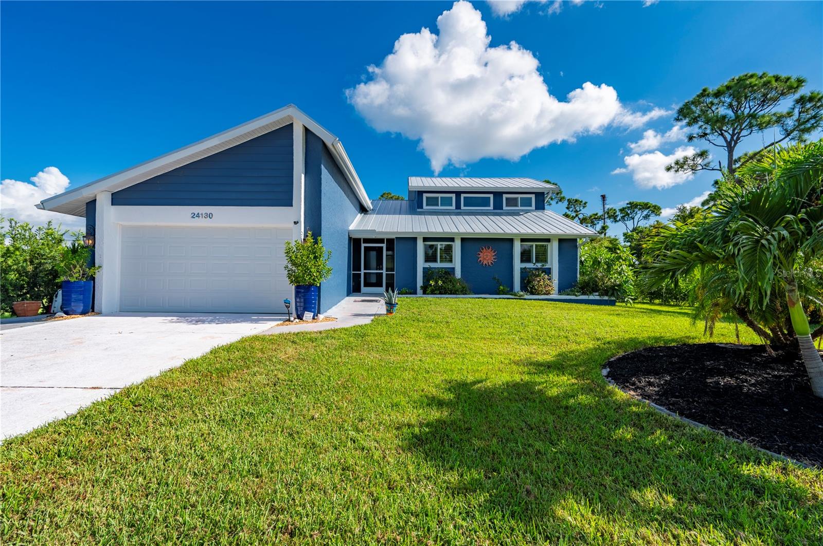 Welcome to Burnt Store Lakes, a Deed Restricted Community that offers the Residents of Burnt Store Lakes a Community Park, with covered picnic benches, Playground and restrooms, along with a Kayak ramp which allows access to Pristine Charlotte Harbor and the Charlotte Harbor Aquatic Preserve, come enjoy nature at its finest. This Beautiful Custom Two-story Home features Four(4) Bedrooms, Three(3) Full Bathrooms, Soaring Ceilings, Spacious Living Room with Fireplace, Separate Dining Area, Galley Kitchen with Granite Countertops, Stainless Steel appliances and a Cozy Breakfast Nook, Custom Designed Butler's Pantry offering ample storage, Inside Laundry Room, the Primary Bedroom is located downstairs with access to the Lanai, along with two Guest Rooms and Guest Bath, upstairs there is a Full Guest En-Suite with a covered balcony overlooking the Pool area and the Greenbelt, giving your Guest there very own retreat, screened expansive Lanai which steps down to the Pool and Spa area, also a screened front Patio leading to the Double Door entry and an attached Two(2)Car Garage, all situated on .48 of an Acre. Plus you will be right across the street from the Burnt Store Marina Golf Course & Country Club and the Fairway Cafe, and you will be a mile from the Safe Harbor Burnt Store Marina, Wet and Dry Slips, Two(2) Restaurants, Tennis courts, Pickleball courts and a Resort-style Pool and a fitness center. And just a short Drive to Punta Gorda, Cape Coral or Fort Myers, and all that Southwest Florida offers. We invite you for a Tour of this Custom Home.