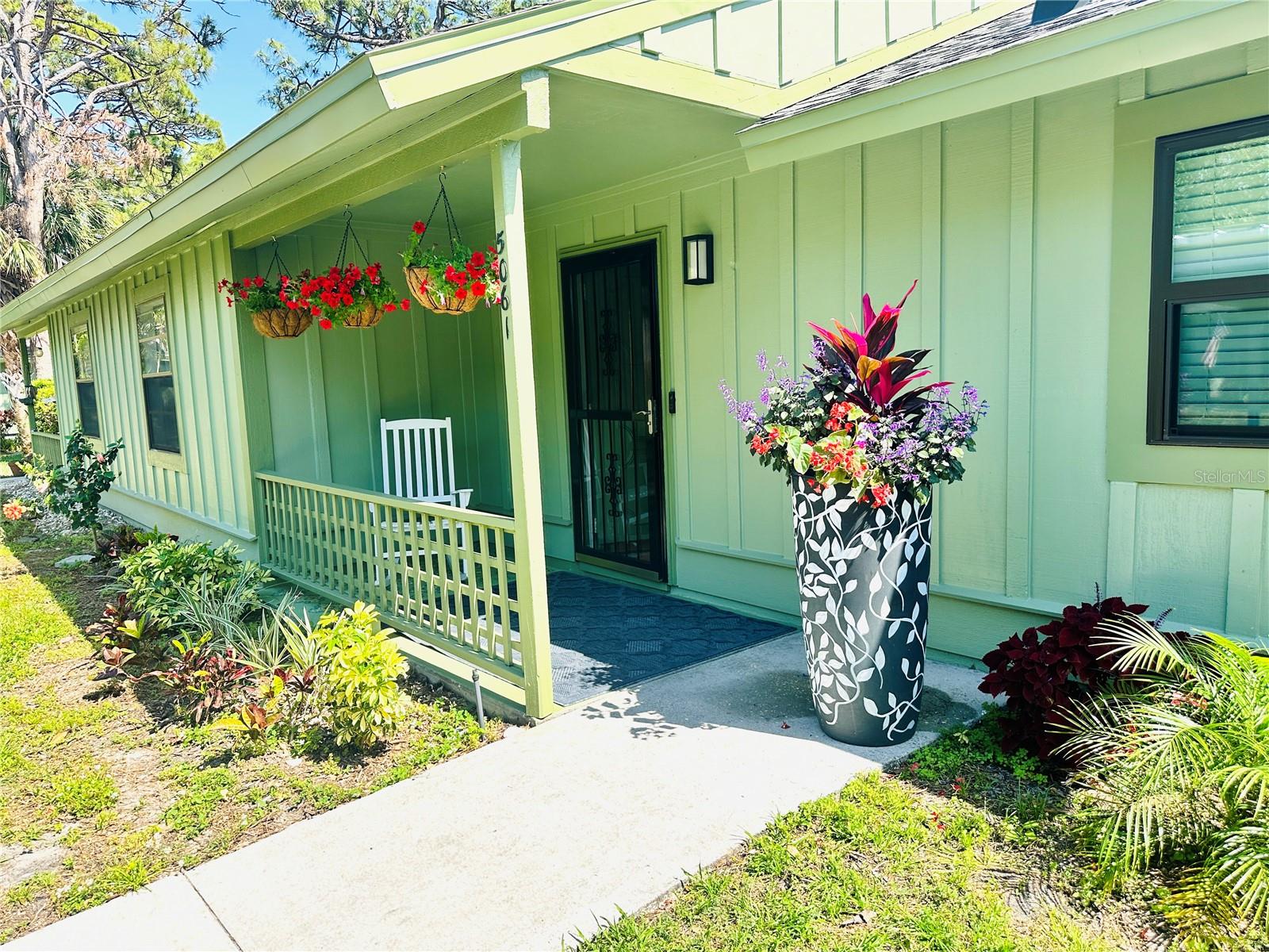 Luxurious living with all the upgrades less than a mile from FSU Center for Performing Arts, Ringling Museum, New World College, Asolo Theater, and SRQ (10 minutes to downtown, 15 minutes to St Armand’s Circle/Lido Key Beach, 20 minutes to Siesta Key). This condo has been renovated to the hilt to give the feel of living in a luxury hotel. Enjoy high-end, first-class comfort and style in a superb location for a fraction of what you would pay for a comparable unit just a couple of miles south in downtown. New hurricane windows 2025, freshly painted interior and exterior. New roof in 2022. New A/C unit in 2021. Abundance of natural light. Kitchen: new white with gold, blue, and gray marbled quartz countertops, new stainless double sink with disposal, new faucet fixtures, new reverse osmosis tankless water filtration system, lots of cabinets and a pantry for storage. Stainless refrigerator, black glass-top stove, dishwasher. Bathrooms: new fixtures, gorgeous Victorian wooden vanities, multi-layered filtration systems on sinks so you can brush your teeth and wash your face with the cleanest water. Florida room (aka lanai) is fully enclosed with big sliding glass windows overlooking new landscaping (palm trees and flowers) with new tropical ceiling fan. Like-new gray waterproof laminate wood floors throughout. Large family room open-space area for couches, tables, dining, and such. Front-loading nearly-new washer and dryer in their own closeted area with storage shelves above. Generous primary suite with walk-in closet, barn door to bath and dressing area. Charming guest bedroom with crown molding and white piping on the walls, baseboards and ceiling light details add class and style. Front porch big enough for sitting or for large potted plants. Outdoor storage closet (that locks securely) for storing your gardening tools, beach chairs and bicycle. Lawn maintenance included. Sprinkler system for lawn. Short stroll to the pool just across the quaint wooden private pedestrian bridge over the pond where the birds and turtles frolic. Your own parking space in front of the unit under the cover of a carport. Plenty of guest parking available nearby. Pets allowed up to 30 lbs. Move-in ready with some furnishings available upon request. (Seller provided description)