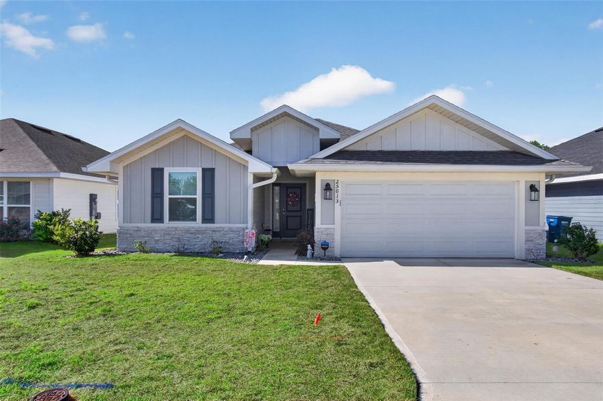 Country Way South – JUST LIKE NEW – is not an exaggeration!  This elegant 4 bedroom, 2 bath home is only 3 years old and the owner has not lived here full-time so it has been very lightly used and is in truly pristine, move-in condition.  It is elegantly appointed with carefully selected upgrades including plank tile flooring, plush carpeted bedrooms, granite countertops, stainless steel appliances, modern fixtures, LED lighting, plantation shutters and brushed nickel faucets.  The kitchen with island breakfast bar and pantry is open to the dining and living areas, while a welcoming foyer leads to two guest bedrooms and a full bath. The primary suite is a true retreat, featuring a walk-in closet, dedicated shoe closet, and a luxurious en-suite with dual sinks, granite vanity, large, walk-in shower, and linen closet. a laundry room with washer and dryer, and a two-car garage.  Enjoy Florida living year-round on the large covered lanai.  This is a premium lot backing to a common, open area so there will be no homes directly behind this lot.  This beautiful home comes fully equipped with all appliances included.  Newberry is one of Alachua County’s most popular towns with shopping, dining and entertainment venues all close by.