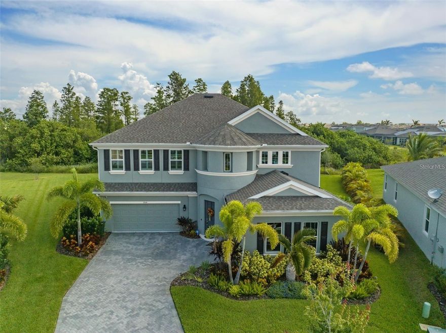 Welcome to this beautiful home located over half an acre within the Resort- style community of Waterset.  This impressive, two story house offers a rare layout with two primary suites and thoughtfully designed spaces for both every day living and entertaining. As you enter, the open foyer immediately creates a welcoming sense of space and style that carries throughout the home. The entry opens with an expensive main living area featuring an open design that connects the living room, dining, space, and kitchen, seamlessly. Plantation shutter throughout the home ads character and allow natural light to enhance every room, a private office or study on the floor provides the ideal setting for working from home or quite relaxation.
The kitchen is designed to impress, equipped with premium appliances, generous counter, space, and expensive cabinetry overlooking the main living area, it creates the perfect setting for hosting guests or enjoying casual family meals. Outdoor living, truly shines with resort style backyard the heated pool, spacious patio, create an ideal environment for entertaining year around with your landscaping, surrounds the space, offering privacy and a peaceful atmosphere.
One primary suite is conveniently located on the first floor  features a luxurious bathroom with double vanity and a walk-in closet . Upstairs a flexible, loft area offers endless possibilities, whether used as a media room, play space, or additional lounge. The second primary suite upstairs provides a private retreat with an en suite bathroom and walk-in closet. High-quality finishes and attention to detail are showcase throughout the home located in the sought neighborhood. The home features a complete laundry room with upgraded cabinets and a deep utility sink. Outdoor living is enhanced by a screened enclosure, travertine decking, and a heated pool with a waterfall, creating an ideal space for relaxation and entertaining. A gas line is already in place, offering the opportunity to add a future outdoor kitchen. Additional upgrades include hurricane shutters, epoxy quoted garage floors, and an installed Tesla charging station. The property is also equipped with a full gutter system, and a water softener adding both convenience in long-term value. This property combines quiet living with easy access to shopping, dining, and entertainment. Schedule your private tour today and discover a home that delivers comfort, space, and elegance in every detail.