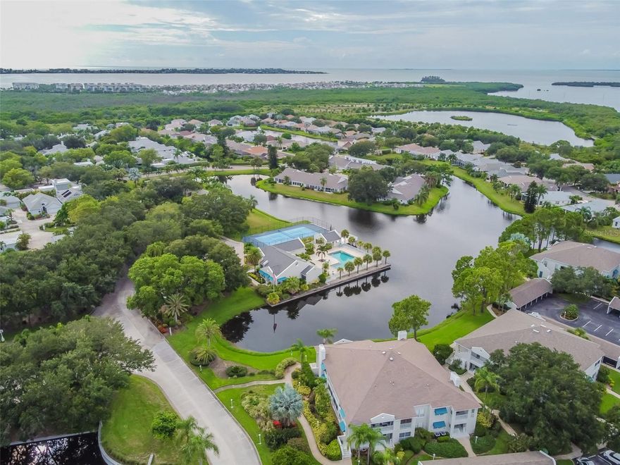 Coastal Living at Its Finest! Just 2 miles from the award-winning white sandy beaches of Anna Maria Island, this stunning, fully furnished first-floor condo in Perico Island is the perfect coastal getaway in sunny Bradenton, Florida. Thoughtfully transformed, this beautiful 2-bedroom, 2-bathroom home showcases quality furnishings throughout, stainless steel appliances, granite countertops, and the convenience of an in-unit washer and dryer. Recent upgrades include a brand-new HVAC system and hot water heater, ensuring modern comfort and efficiency.

Step inside to find a bright, airy open layout filled with natural light from numerous hurricane-impact windows. The well-appointed kitchen offers a cozy eat-in area and a separate dining room—perfect for entertaining or relaxed meals at home. Both bedrooms are generously sized, with the primary suite featuring a private ensuite bath for added comfort and privacy.

Perico Island offers resort-style amenities, including a newly renovated clubhouse with a fitness center, billiards room, library, and saunas, plus a heated pool and tennis/pickleball courts. Surrounded by the scenic beauty of Robinson, Perico, and Neal Preserves, this prime location is ideal for outdoor enthusiasts and beach lovers alike. Enjoy boating, fishing, golfing, shopping, and dining—or simply unwind on the pristine shores of Anna Maria Island, just minutes away over the drawbridge.

Whether you’re seeking a turnkey seasonal retreat or a year-round coastal haven, this exceptional condo is ready for you to move in and start living the best of Florida’s coastal lifestyle today!