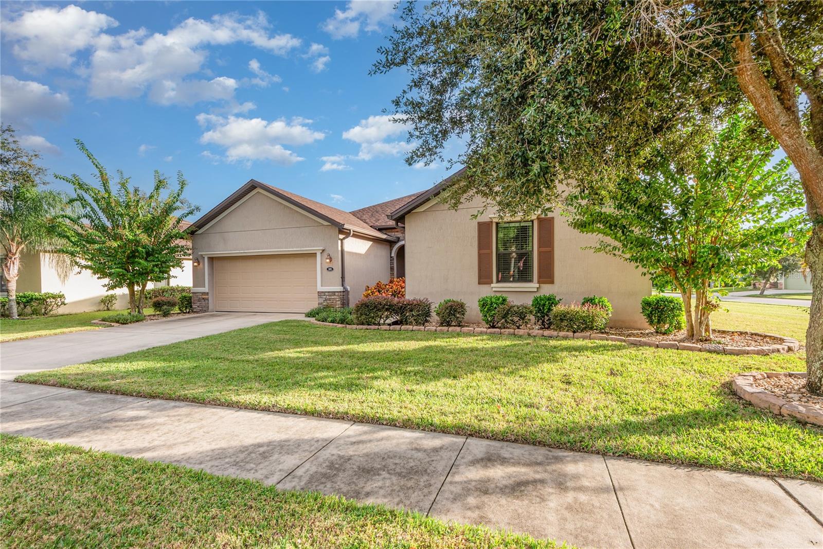 One or more photo(s) has been virtually staged. Furnishings only. Welcome to Tuscany Woods! This desirable Daytona Beach community offers an exceptional lifestyle with amenities designed for relaxation, recreation, and convenience. This beautifully maintained corner-lot residence is move-in ready and showcases pride of ownership throughout. With 2,259 square feet of air-conditioned space, the home features two spacious living areas, a formal living room and a comfortable family room with a cozy fireplace. The family room flows seamlessly into the open dining area and kitchen, creating an ideal layout for entertaining. The kitchen offers granite countertops, a breakfast bar and stainless-steel appliances, making it stylish and functional. Enjoy peace of mind with a 2022 new roof and 2022 new air-conditioning system, plus a beautifully constructed enclosed Florida room with windows, shades and upper transom windows that bathe the space in natural light while maintaining privacy. Let's not forget about the indoor laundry room with a stainless steel washer and dryer. From here, take in tranquil views of the pond and fountain surrounded by a lush, manicured lawn enhanced by a well and sprinkler system. The oversized primary suite occupies a private corner of the home, offering serene views of the pond and backyard. The primary bath features a dream walk-in closet, granite vanity, linen storage and a private water closet. A versatile flex room provides the space for an office, craft room, music room or additional bedroom. Two guest bedrooms and a full bath complete the thoughtful split floor plan. The home is completely tiled throughout, offering elegance and easy maintenance. Residents of Tuscany Woods enjoy a variety of community amenities, including a private pool, clubhouse and social hub, playground, and sidewalk-lined streets for recreation and jogging. The neighborhood's picturesque lakes, mature landscaping, and wooded surroundings create a serene and welcoming atmosphere. Conveniently near Strickland Range Road, Holland Avenue and U.S. 1, Tuscany Woods offers a peaceful suburban setting just six miles from the Daytona Beach coastline. Nearby attractions include Robert Strickland Park with lighted sports fields and a BMX track, Tanger Outlets for shopping and dining, and numerous entertainment options. Zoned for Champion Elementary School, David C. Hinson Sr. Middle School and Mainland High School, this community combines comfort, location and lifestyle.  Please note the following, home is vacant and has no furnishings.  All furnishings have been virtually staged. The fire in the fireplace has also been virtually done, there isn't a propane tank but it can easily be added. Or new buyer may wish to make it electric.