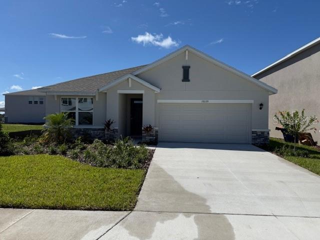 Beautiful, BRAND NEW HOME FOR YOU. Beautiful WATER VIEWS. Sit on the covered back porch and enjoy your morning coffee or nightcap. This spacious 3 bedroom / 2 bath home has an outstanding, open layout which optimizes the living space. One-story, two car garage layout. Open kitchen overlooks the living area and dining room, which include extended tile. The well-appointed kitchen features all new stainless steel appliances, including refrigerator, built-in dishwasher, electric range and microwave. Main bedroom is located at the back of the home for privacy features an en suite, large bath including dual sinks and vanity. The additional bedrooms share a bathroom. All kitchen and bath counters are solid stone and look amazing. The laundry room comes equipped with washer and dryer. Large garage and driveway for great parking. Beautiful outside landscaping. Modern look throughout and squeaky clean and fresh. Never lived in so you will be the first. Excellent landlord. 1,672 sq feet is more than enough for your needs. Community is awesome and features a community pool, pool area with covered eating areas and grilling availability, playgrounds and more. Great location in award-winning Lakewood Ranch and near stores, restaurants, library, parks and more.