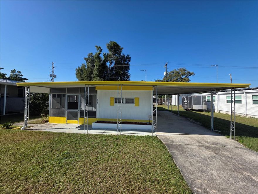 Looking for an affordable seasonal escape in sunny Florida or a budget-friendly permanent home in a vibrant 55+ community? This charming 2-bedroom, 1-bathroom home with additions might be just what you need. A freshly painted exterior offers a cheerful welcome as you arrive, with a long driveway and attached carport perfect for parking or entertaining, plus a covered front walkway leading to a vinyl-enclosed screen porch. Inside, there’s a bonus room accessible from the porch or open to the central living room, which features decorative lighting, laminate floors, and a built-in display hutch, which flows into a spacious eat-in kitchen at the front of the home. Toward the back, you’ll find a full hall bath, an add-on guest bedroom with dual closets and built-in dressers, and a primary bedroom with the same plus a convenient built-in desk for extra storage. An attached utility room offers double doors for golf cart parking, a washer/dryer, plenty of storage, a sink, and a workbench with vice and pegboard. Sold partially furnished with all major appliances included, this home is located in Betmar Acres, one of Florida’s most desirable 55+ communities where you own your land—no lot rent! With annual park dues of just $435, you can enjoy an active lifestyle with amenities like heated pools, hot tubs, golf, pickleball, bingo, and shuffleboard, all in a prime central Florida location close to hospitals, shopping, restaurants, and just an hour from theme parks and award-winning Gulf beaches. Call for more information or schedule your own private tour today!