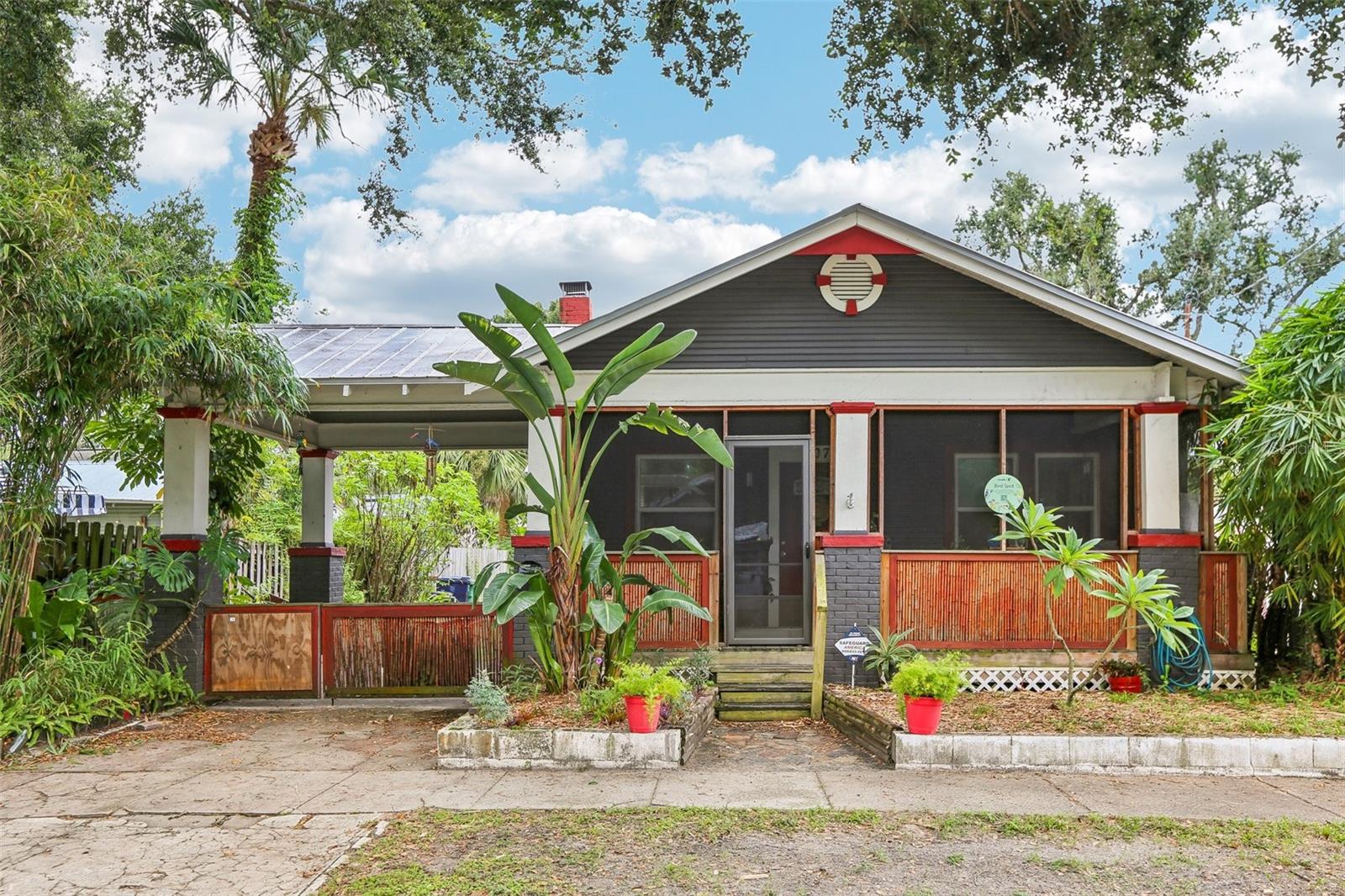 Welcome to this STORYBOOK 1926 BUNGALOW in the heart of Seminole Heights! This 2-bedroom, 1-bath charmer is filled with timeless character and thoughtful updates and even has a space which could serve as a large office, den, or craft room. From the original HARDWOOD floors, cozy FIREPLACE and BUILT-IN features, which include the CUSTOM BUILT sidebar in the dining room, to the inviting screened front porch, you’ll fall in love with its warmth and style. The UPDATED kitchen blends modern convenience with historic charm, while the METAL ROOF and covered CARPORT provide peace of mind and practicality. Step outside to enjoy a true backyard oasis—certified as a BIRD SPOT by Cornell University, also has a butterfly garden, perfect for nature lovers. A shed offers extra storage, making the space both functional and delightful. Beyond the home itself, you’ll love the lifestyle it offers. Stroll to Seminole Heights’ many local coffee shops, acclaimed restaurants, and trendy breweries, all just blocks away. The neighborhood is known for its walkability, welcoming vibe, and thriving community spirit. Whether you’re looking for a wonderful short-term rental opportunity or your forever home, 507 E Knollwood St is a rare chance to own a piece of Tampa’s history in one of its most sought-after neighborhoods.