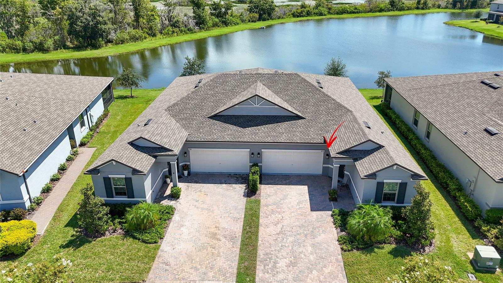 Opportunities like this don’t come along often—this Connerton villa offers not just a home, but a lifestyle. Set on one of the most desirable lots in the community, it showcases an incredible pond and conservation view that brings daily peace and beauty right to your back door. Imagine sipping your morning coffee or winding down with an evening cocktail while surrounded by nature in complete serenity—this is the retreat you’ve been waiting for. Step through the inviting foyer with its elegant tray ceiling and discover a thoughtfully designed great room floorplan featuring 3 bedrooms, 2 full baths, and a 2-car garage. The heart of the home is the kitchen, where 42-inch cabinets with pull-out shelving, quartz countertops, a walk-in pantry, and a convenient breakfast bar come together seamlessly. Stainless steel appliances are included, and so are the washer and dryer—making this a truly move-in ready opportunity. The primary suite is a private retreat of its own with a generously sized bedroom and a spa-like ensuite bath featuring two separate quartz-topped vanities, a walk-in shower, and an extremely large walk-in closet. The benefit of such an oversized closet is simple—it provides ample storage for clothing, shoes, and accessories while keeping your living spaces free of clutter, ensuring everything has its place. Additional thoughtful touches include 5 1/4" baseboards, crown molding in the living areas and primary suite, and oversized oblong tile flooring that enhances the home’s spacious feel. Luxury vinyl plank flooring in all bedrooms means no carpet anywhere, a highly desirable feature for easy maintenance and modern living. The laundry room offers both cabinets and a separate folding counter, making chores efficient and organized. Outdoor living is just as impressive with a screened lanai finished in brick pavers—perfect for relaxing or entertaining—while the brick-paver driveway adds curb appeal from the moment you arrive. Ceiling fans throughout add comfort, and every detail has been considered to make this home as beautiful as it is functional. Living in Connerton means enjoying a vibrant community with resort-style amenities including a sparkling pool, snack bar, fitness center, tennis courts, parks, and so much more. Homes with this combination of location, lot, and features are rare—schedule your private showing today before this one is gone!
