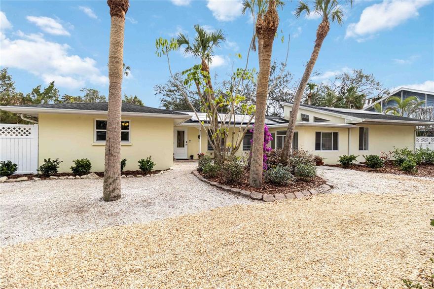 One or more photo(s) has been virtually staged. Welcome to this beautifully renovated ranch-style home, ideally located within minutes to the #1 beach in the United States—Siesta Key Beach! Set on an oversized lot, this property offers a private outdoor oasis with a relaxing pool surrounded by lush, mature landscaping, perfect for entertaining or unwinding after a day at the beach. Designed for effortless single-level living, this home blends modern updates with timeless coastal style, making it perfect as a full-time residence, vacation getaway, or investment opportunity. Offering 3 spacious bedrooms + den and 2.5 updated baths, the thoughtfully designed floor plan delivers both comfort and functionality. Light-filled living areas flow seamlessly throughout the home, complemented by a stylishly updated kitchen and baths featuring quality finishes. A detached garage adds valuable convenience and storage. Recent upgrades include a 2024 Tesla solar system with two Powerwall's, providing energy efficiency, backup power, and long-term savings. Additional improvements include two HVAC systems for optimal climate control and a new water heater for added peace of mind. Enjoy morning strolls to the world-renowned quartz sands of Siesta Key Beach, evenings dining at Siesta Village, and the ease of move-in-ready coastal living in one of the most sought-after locations. All information should be independently verified by buyer's and buyers agent.