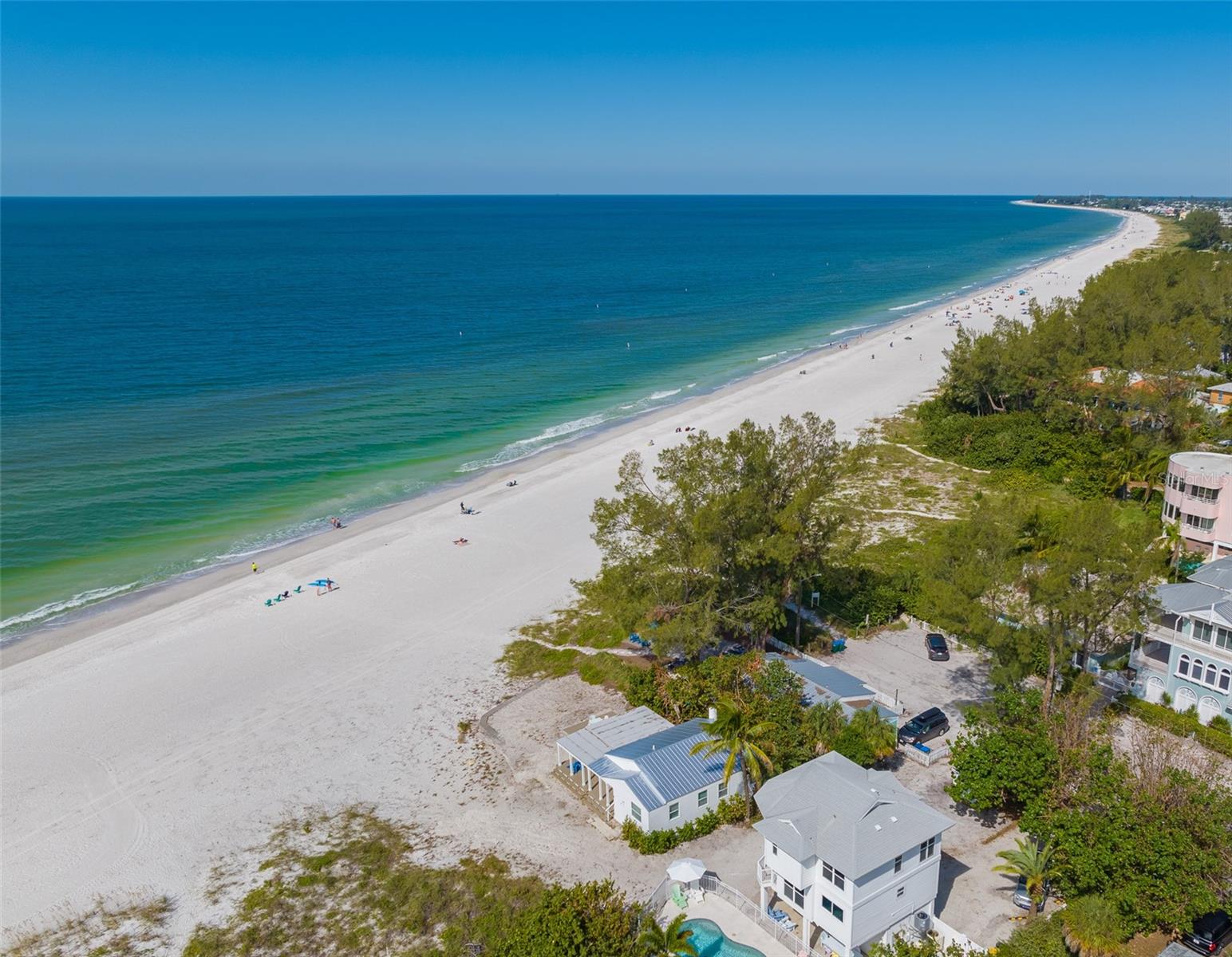 TWO PROPERTIES sitting directly on the Gulf of Mexico Beaches in Holmes Beach!! Both properties just had a refresh, including paint exterior and interior and new decorating throughout. “Turtle Watch” is an amazing 3 bedroom, 3 bathroom elevated home directly overlooks the gorgeous Gulf beaches from every bedroom. You will also love the Gulf-facing private heated pool! Sit back and relax as you get to watch the sunset from the privacy of your own living room or step out to the open-air balcony. The Master suite offers a sweeping view of the Gulf waters from its large windows designed to offer the best sights. The second and third bedrooms also both offer fabulous Gulf views that just can’t be beaten! Hidden away off a quiet residential street on Holmes Beach, you are still just a short walk or bike ride away from the island’s only fully stocked grocery store, delicious local restaurants, and island boutiques. “Beach Life at the Point” is the brightly colored 2 bedroom, 1 bathroom old Florida beach cottage. This cottage is a beachfront home that offers a true “Old Florida” feel in its eccentric aesthetic and décor. Enjoy the unique bright colors of the home, the large “backyard” area, and of course, the fact that it sits literally on the beach. When you walk into the home’s common living area, you’ll see the kitchen, living room, and dining room. The kitchen is updated with beautiful granite countertops, stainless steel appliances, and a lovely breakfast bar. It doesn’t get any better than having the stunning beaches of the Gulf of Mexico in your own backyard! Walkout to the white sandy beaches and enjoy time at the pool or simply head to the crystal clear Gulf waters. These versatile homes offer the best of both worlds!