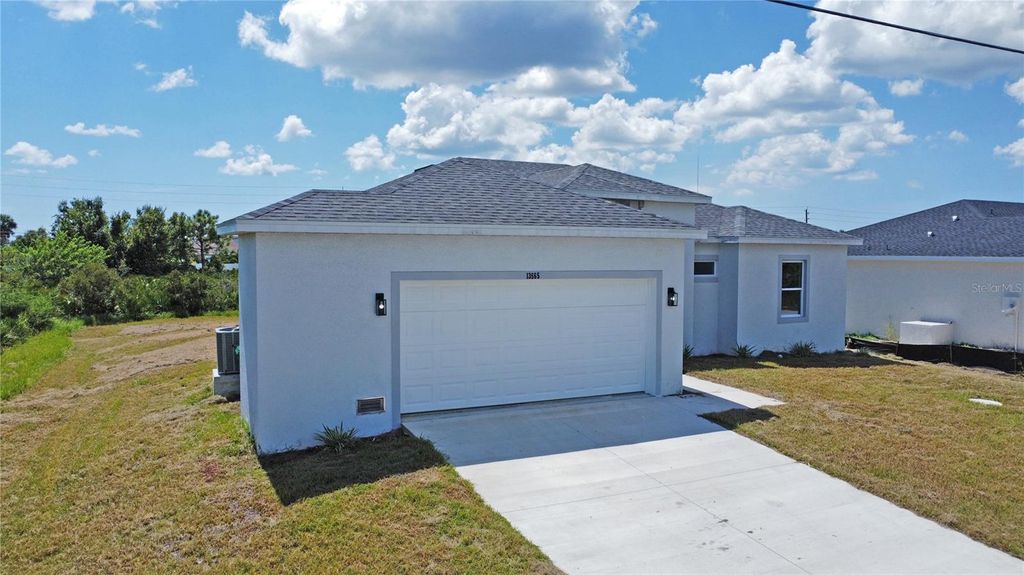 Photo of 13565 Jeronimo Lane, Port Charlotte, FL 33981 (MLS # O6285991)