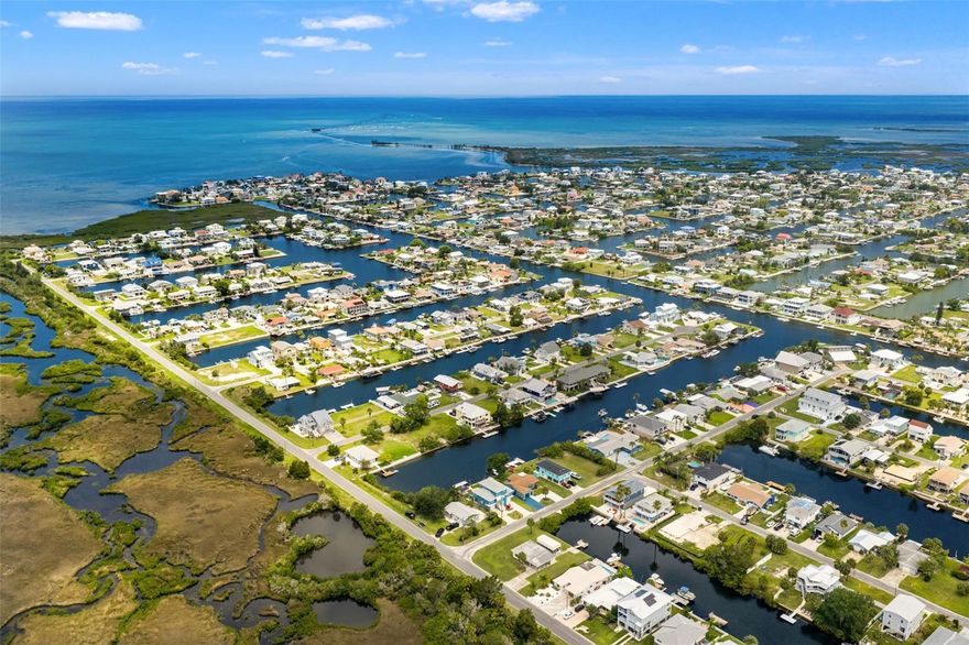 Tucked along a deep water canal with DIRECT GULF ACCESS, this 60x100 waterfront lot invites you to bring your coastal dreams to life. Imagine waking up to the glisten of morning light dancing on the water, with no bridges between you and the open sea—your boat, your breeze, your freedom.
The lot features a brand-new seawall with endcap and steps—a $55,000 investment already in place, saving you time and money as you plan your perfect build. This rare gem offers R1B zoning for a single-family home and sits gracefully in a flood zone, requiring an elevated design—ideal for capturing unobstructed views of tranquil wetlands and surrounding natural splendor. The neighboring home lies low, ensuring your future build rises into panoramic beauty.
And the sunsets? They’re nothing short of spectacular—painted skies that stretch endlessly over the Gulf, best enjoyed from your future balcony or private dock.
Here in Hernando Beach, there are HOA or CDD rules to curb your vision. Whether it’s a peaceful escape, a vacation investment, or a forever home, this location offers the flexibility to craft a lifestyle as bold or serene as you choose.
Adventurers and nature lovers rejoice—just minutes away awaits the magical spring-fed waters of Weeki Wachee, perfect for kayaking, manatee sightings, and lazy swims under the sun. As the day winds down, explore local eateries with live music, coastal charm, and that unmistakable small-town soul.
Utilities—water, sewer, and power—are ready at the street, paving the way for a seamless start to your building journey. (Please note: lot lines shown on aerial maps are approximate.)
This isn’t just a lot—it’s a gateway to the Gulf and the lifestyle you've been waiting for.