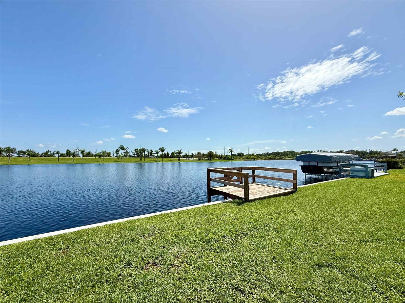 Welcome home to your lakefront oasis on the Clermont chain of lakes! This home is located on the island side of Emerald Lakes with only 41 homes and each one of them being lakefront property. Emerald lakes is a 55+ community with low monthly dues! $305 a month gets you access to great amenities such as lakefront heated community pool, clubhouse with daily activities year-round, including bingo nights, karaoke, poker, and shuffleboard just to name a few. This home is part of the co-op which means you own a share and there is NO LOT RENT. Park your boat in your backyard and cruise over to Salt Shack or Tiki Bar or Clermont Beach on Lake Minneola, The Cove on Lake Minnehaha or cruise down the lazy river to Lake Louisa State Park. No need to spend time mowing because that is included in your HOA dues. Whether you just want to sit by the pool and watch the beautiful sunsets over the lake, fish off your own private dock or hop in your boat and enjoy all that the Clermont chain has to offer this home will not disappoint. This home has just received a new HVAC with 10 yr warranty, both bathrooms have been remodeled, dock was rebuilt, water heater replaced (2024) & fresh exterior paint (2025)! Priced to SELL! Schedule your showing today & start enjoying lakefront living.