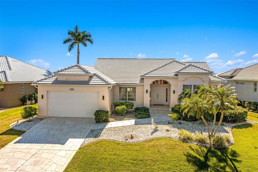 Punta Gorda Isles! Beautiful 3 bed, 2 bath, 2-car garage waterfront pool home with amazing intersecting canal views of wide sailboat basin 
providing access to Charlotte Harbor leading to the Gulf of Mexico. 75’ of water frontage offers concrete dock and seawall with water and electric plus 6,000 lb. lift. This property offers a lifestyle that is truly second to none. As you enter, you'll be captivated by the open floor plan, high ceilings and triple pocket slider in the living area which provides breathtaking water views from the moment you step inside. Interior features built-in accents, neutral decor, and an abundance of natural light that fills every room. Spacious kitchen offers breakfast bar and a casual dining area overlooking the pool, making it the perfect space for entertaining guests. Generous master suite offers long water views and a private ensuite bath with dual sinks, jetted tub and walk-in shower. Step outside to the covered lanai and screened heated 14' x 28' pool, where you can relax and enjoy the serene waterfront views and true southwestern exposure for gorgeous sunsets. Automatic roll down shutters provide added convenience plus manual shutters for complete storm protection. The stamped driveway and mature landscaping add to the curb appeal of this beautiful home. Located in a popular boating and golf community, this home offers easy access to Yacht Club, Fishermen's Village, and the historic downtown area of Punta Gorda. You'll also have the opportunity to indulge in world-class fishing, boating, and fine dining. And if you're in the mood for a beach day, you're just a short drive away. Don't miss out on this incredible opportunity to own a home in this highly sought-after location. Schedule your private showing today!