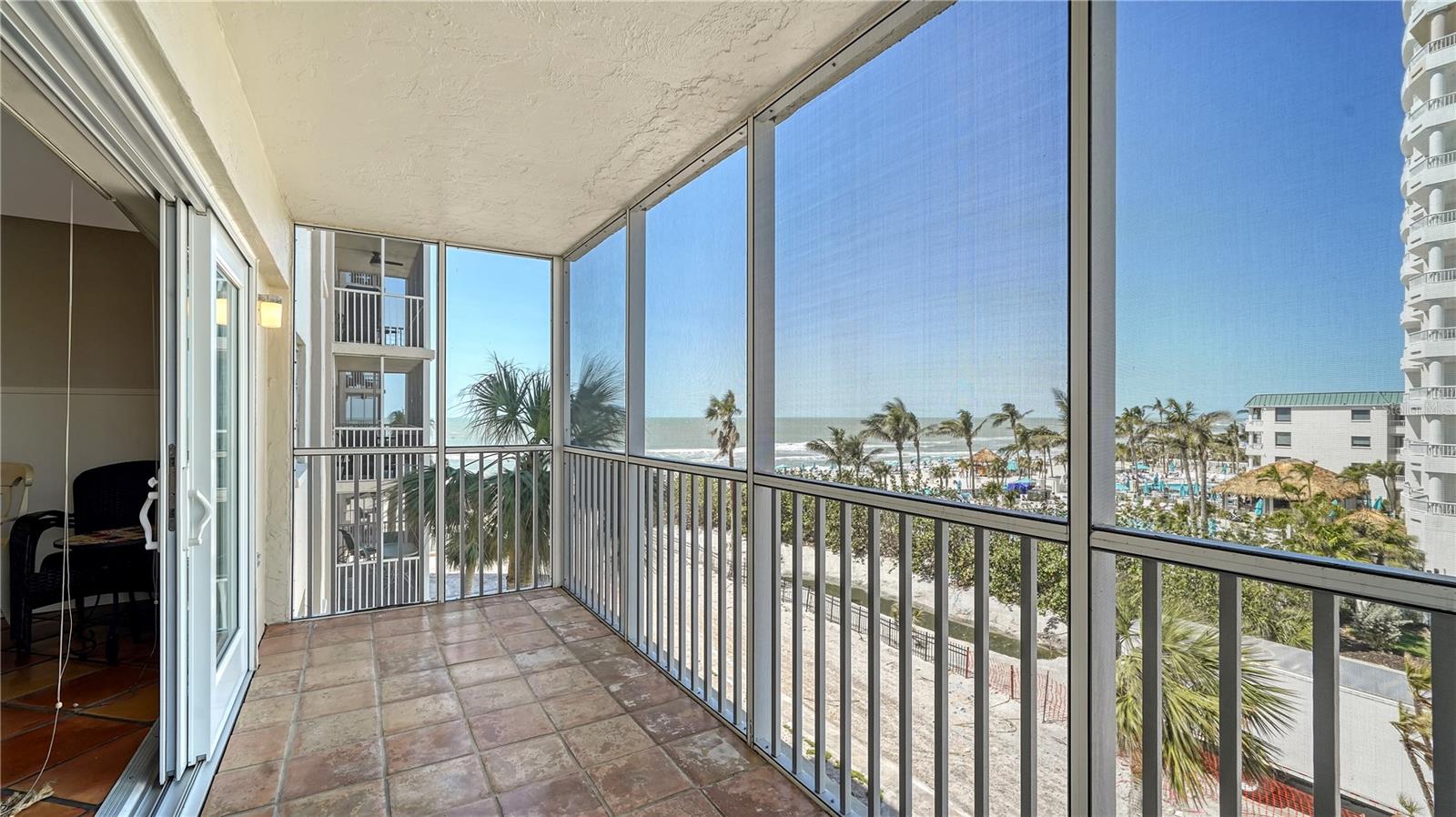 Just steps from the sand. A beautiful Lido Beach RENTAL – ANNUAL OR 6-MONTH LEASE. Lovely 2 bedroom, 2 bath condo with enjoyable Gulf views to enjoy spectacular sunsets. Updated with stainless steel appliances, granite countertops, a spacious bar for entertaining, and tiled floors throughout. Features include a large walk-in closet, screened lanai for sunset views, new A/C, new mattresses, and freshly cleaned ductwork. Resort-style amenities: heated pool, fitness center, outdoor grill, and just steps to Lido Beach. Carport parking and community laundry. No pets. Short beach walk to vibrant St. Armands Circle with shops, dining, and entertainment. Live where others vacation—schedule your showing today!