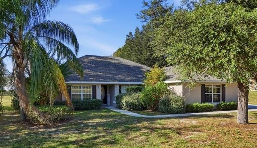 One or more photo(s) has been virtually staged. Here’s a refreshed, more enticing version with elevated language, highlighting the **picturesque golf course setting** and **staged presentation**, while keeping it warm and buyer-focused:

---

**Staged 4-Bedroom Golf Course Home in Black Bear Reserve**

Welcome to refined Florida living in the prestigious **golf community of Black Bear Reserve**. Beautifully **staged** and impeccably maintained, this spacious **4-bedroom home** offers a desirable split floor plan designed for both comfort and privacy.

Step inside to a bright, open-concept layout where natural light pours in, showcasing **brand-new flooring throughout** and an inviting atmosphere perfect for everyday living and entertaining. The well-appointed kitchen features ample cabinetry and generous counter space, making it ideal for hosting gatherings or enjoying casual family meals.

Relax in the expansive living area, unwind on the **10x20 covered lanai**, or retreat to the serene primary suite complete with a private ensuite bath. Perfectly positioned along the **picturesque Black Bear Golf Course**, this home offers peaceful views and a tranquil backdrop—your own private escape.

Enjoy morning walks through this charming community, spend afternoons on the fairways just steps from your backyard, or explore nearby conveniences. Black Bear Reserve is celebrated for its friendly ambiance and prime location close to shopping, recreation, and the quaint boutiques and dining of **historic Mount Dora**.

This is your opportunity to own a move-in-ready, golf-course home in one of **Eustis’ most sought-after neighborhoods**.
**Schedule your private showing today—this one won’t last.**