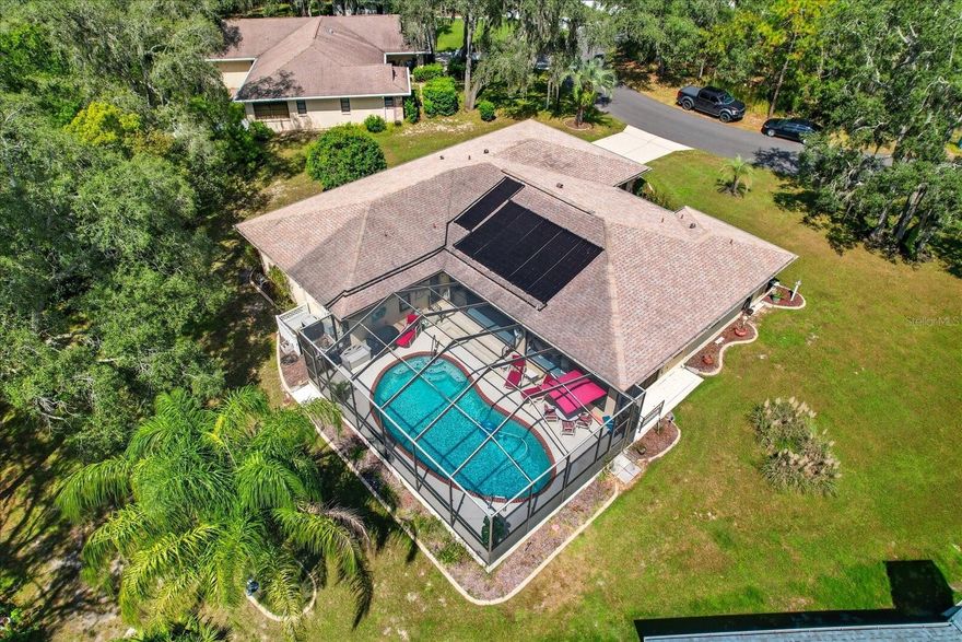 Discover the perfect blend of comfort and style in this beautifully updated pool home tucked away on an oversized cul-de-sac lot in Oak Village of Sugarmill Woods. From the moment you step inside, you’ll feel the warmth of the open floor plan, where natural light pours through sliding glass doors that lead to the sparkling solar-heated pool with a brand-new electric heat pump added in 2025 for year-round swimming. Imagine relaxing in the hot tub, entertaining on the lanai, or enjoying the convenience of a full pool bath just steps away.
The family room sets the tone with its stunning floor-to-ceiling natural stone fireplace, flowing seamlessly into a bright kitchen with abundant cabinetry and a cozy breakfast nook. The master suite opens directly to the pool, while guest bedrooms are privately situated with their own bath and pool access.
Thoughtful upgrades provide peace of mind, including a new AC system with transferable parts warranty (2025), new carpeting in the guest bedrooms (2025), updated bathroom vanity, countertop, and lighting (2024/25), new microwave (2024), new pool pump (2024), and a new automatic solar pool heater controller (2025). An irrigation system and frost-free faucet were also added in 2024, along with two new smoke alarms for safety. The roof was replaced in 2015 and carries a 30-year warranty.
This is more than a house—it’s a retreat where every detail has been cared for, offering you the Florida lifestyle you’ve been dreaming of. Move right in and start making memories.