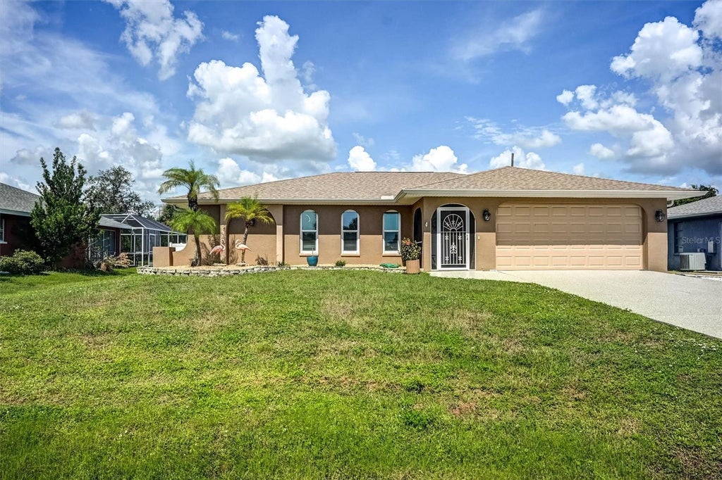 Photo of 726 Calvert Avenue, Port Charlotte, FL 33948 (MLS # TB8556436)