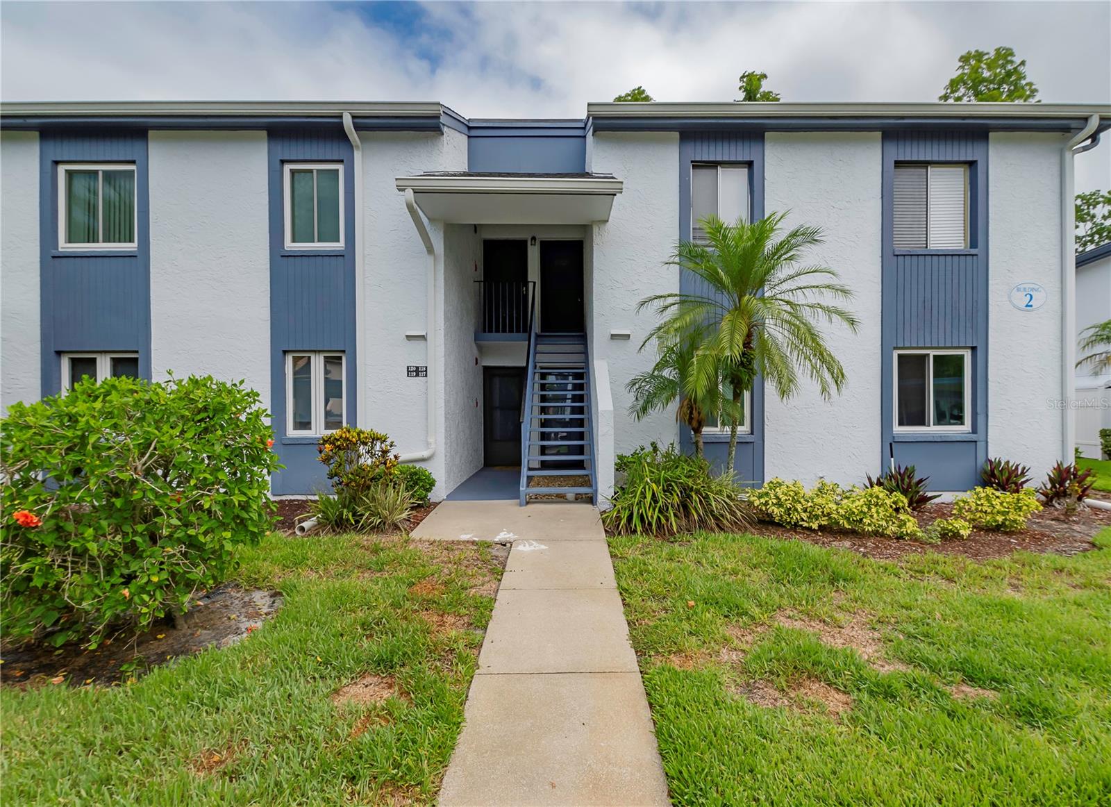 Welcome to your bright and airy second-floor condo in beautiful East Lake Woodlands, FL! This super-clean 2-bedroom, 2-bathroom gem boasts 1053 sq ft of comfortable living space. You'll love the updated bathrooms with vintage tile and updated vanities, along with the easy-to-care-for vinyl flooring throughout the rest of the home. The modern kitchen is a tenant’s dream, featuring quartz countertops, stainless steel appliances, and sleek white cabinets. Enjoy your morning coffee on the private screened balcony, or take a dip in the sparkling community pool. With a washer and dryer right on the lanai and ceiling fans throughout, this condo has it all! Plus, updated windows, vertical blinds, fresh paint, and tons of closet space, including a walk-in closet in the primary bedroom. And don't forget your designated parking space! Located close to shopping, restaurants, and a short drive to the world-famous beaches of Pinellas County, this is Florida living at its finest!