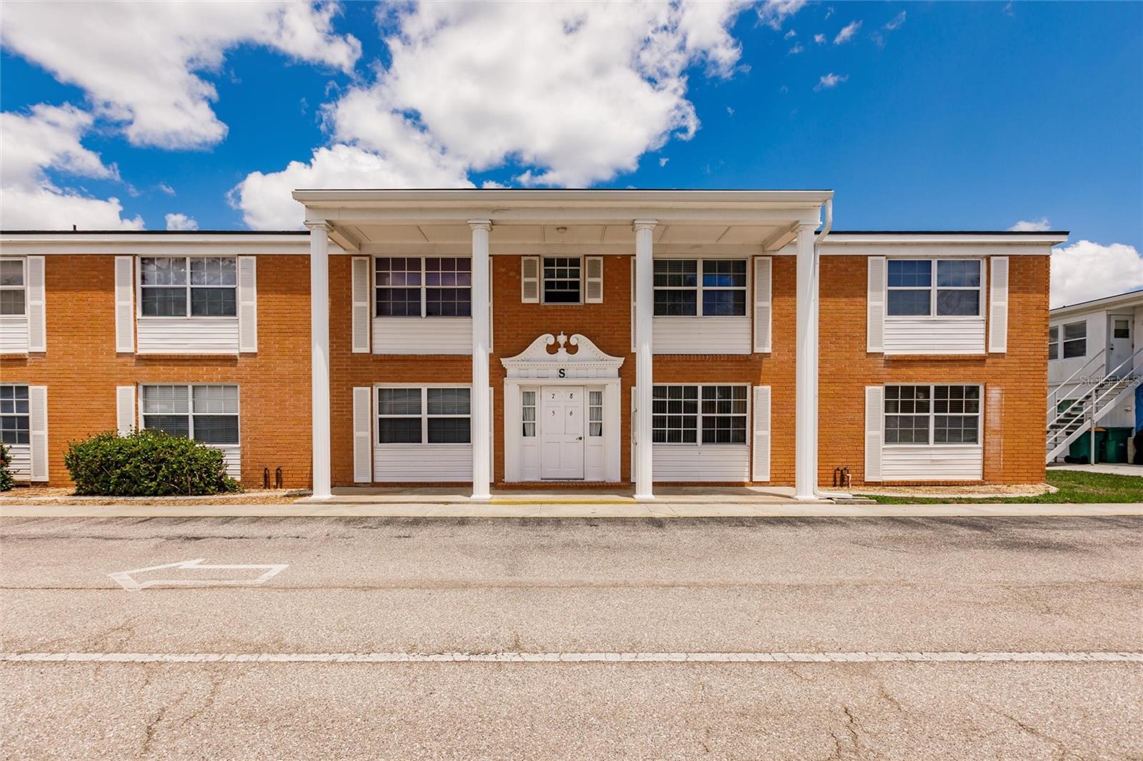 ANNUAL UNFURNISHED - ground-floor in one of Port Charlotte’s most desirable 55+ communities—Maria Manor. This spacious 2-bedroom, 2-bath corner unit showcases tile and wood laminate flooring throughout for easy upkeep and modern appeal. The kitchen features a convenient walk-in pantry for added storage. The primary bedroom has a large wall closet and an attached bath with walk-in shower. Guests will love their own bedroom with walk-in closet and access to a full bathroom. The bonus room offers direct access to the pool area and includes an in-unit washer and dryer for your convenience. This versatile space can be used as a home office, reading nook, hobby room, or even a guest sleeping area. The condo also comes with a deeded carport (#5) with storage closet. Rent includes water and basic cable TV. Ideally situated just off US-41, close to medical facilities, grocery stores, restaurants, and shopping, making every day errands a breeze. Maria Manor offers a welcoming, active lifestyle with amenities that include two heated pools, shuffleboard courts, a clubhouse, pool table, bingo, card games, and a full calendar of seasonal activities. The friendly atmosphere and strong sense of community will make you feel right at home.  With everything in place, this condo is truly move-in ready. Don’t miss your chance to own a low-maintenance home in a fantastic location. Come see why residents love life at Maria Manor—schedule your showing today!