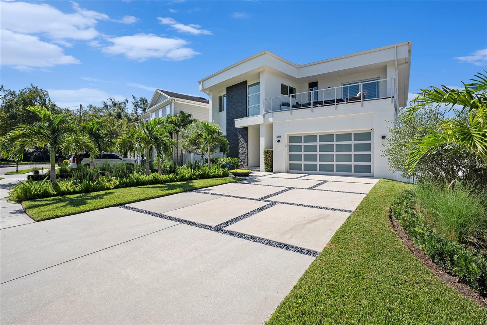 For residents seeking SEAMLESS INDOOR/OUTDOOR LIVING, RESORT STYLE AMENITIES, and WARM CONTEMPORARY DESIGN in South Tampa’s prized Plant High District, this residence offers privacy, easy entertaining, and everyday comfort. This 4 BED/3 BATH, 3,221 SQ FT residence welcomes you with LARGE GEOMETRIC PAVERS, SMOOTH STONE INFILL, and LUSH TROPICAL LANDSCAPING. As you enter the home you are greeted with grand FLOATING STAIRCASE. Further in, the AIRY GREAT ROOM connects through IMPACT RATED SLIDERS to a COVERED PATIO with MOTORIZED SCREENS beside the NEW LUXURY POOL, all wrapped in CUSTOM TROPICAL LANDSCAPING for a private retreat. The CHEF’S KITCHEN features KITCHEN-AID STAINLESS APPLIANCES, STONE COUNTERS with WATERFALL EDGE, BRASS HARDWARE, a WALK IN PANTRY, and STATEMENT PENDANT LIGHTING, with dining under a MODERN CHANDELIER. Main level floors are WOOD LOOK TILE. The upper level flows on LUXURY PLANK. Upstairs, an UPSTAIRS LOUNGE, a SECOND ENTERTAINMENT ROOM, and an OPEN AIR BALCONY invite relaxed gatherings. The OWNER’S SUITE adds an EXPANSIVE SPA INSPIRED BATH, a DUAL WING WALK IN CLOSET, and a covered balcony. IMPACT RATED WINDOWS AND DOORS provide peace of mind. The home conveys with an ASSUMABLE FLOOD INSURANCE POLICY and a history of no flood events. An OVERSIZED GARAGE completes the offering. Don’t hesitate to schedule a tour today as this is truly a rare residence!
