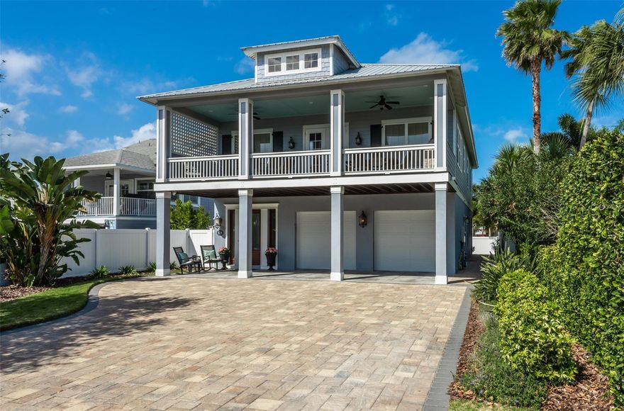 Immaculate 2016 4 bedroom, 4 bath Hickson-built home with in-law quarters in the SHORT TERM rental zone.   Great location approximately 600’ to the beach.  Custom throughout! Two stories with elevator.  Beautiful engineered wood floors. Quartzite, granite and marble counters.   Master suite with soaking tub and trough sink.  Repurposed vintage doors, custom window treatments.  Summer kitchen on spacious deck.  Natural gas for stoves, both tankless water heaters, fireplace, 22kw generator and bbq grill.  Impact double pane windows, metal roof. First level in-law quarters is accessible via a separate entrance but floorplan allows for easy modification to connect the interior spaces if desired.  Oversized garage and ample parking for guests.  Paver driveway and walkway.  Restaurants and shopping are an easy walk or golf cart ride to Flagler Avenue just six blocks away.  Washer/dryers both up and down. ;Water: City