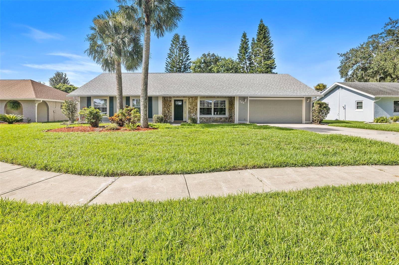Welcome to your new home in Port Orange! This stunning four-bedroom, two-bathroom residence is located in a highly sought-after community and ready for its new owners. Inside, you'll find beautiful finishes throughout, with an undeniable level of craftsmanship and attention to detail. This home is perfectly situated in a top-rated school district, just a short drive from the beach, and minutes from shopping and dining. The community offers a clubhouse, pool and tennis/basketball court, with the added benefit of a voluntary HOA. Key features include a newer roof, newer appliances, granite countertops, Bahama shutters, hurricane shutters, a fireplace and tile flooring throughout. The floor plan provides ample space to grow, while the fully fenced backyard is an outdoor oasis, complete with a Hot Springs hot tub. Don't miss the opportunity to see this exceptional property!