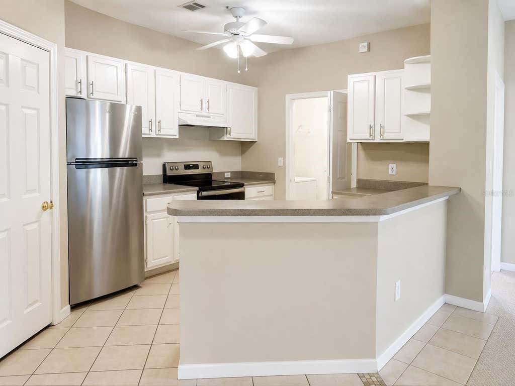 Photo of 2603 Maitland Crossing Way #101, Orlando, FL 32810 (MLS # O6436936)