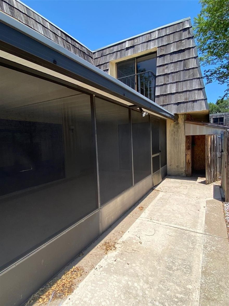 NEW ROOF - 2 Bedrooms upstairs (one overlooking pond with fountain) each with their own private bath and both with balconies. Downstairs there is a half bath for guests. Kitchen has sliding glass doors to covered patio as does the living room. All appliances are included. There are 2 storage units