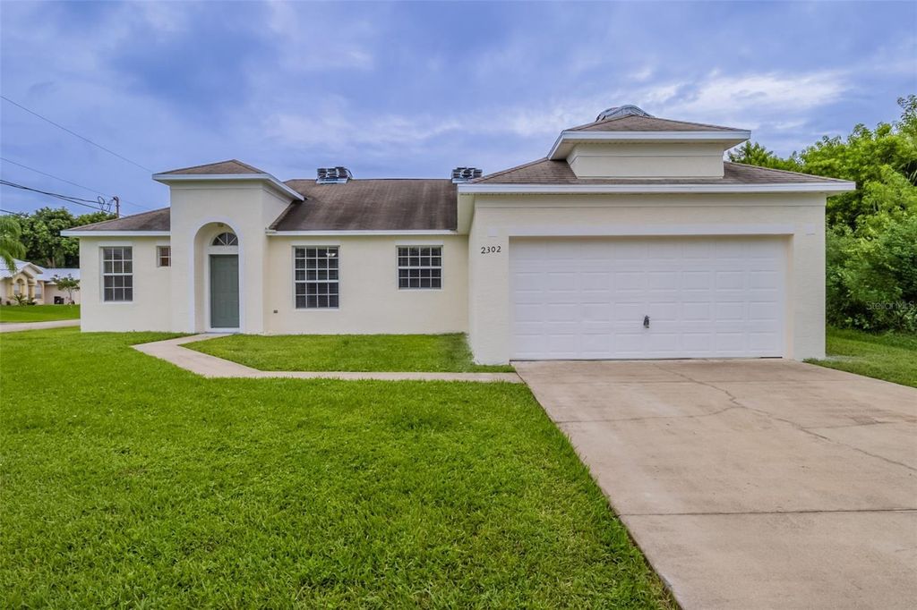 Photo of 2302 SW Webster Lane, Port Saint Lucie, FL 34953 (MLS # O6352118)
