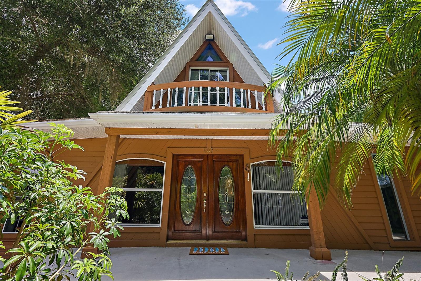 Boaters and Fishermans Retreat 3/2 1,800 sf. A boater’s dream. This unique home is the ideal retreat and it boasts a significant history; please refer to the attachments for this home’s fascinating story. Ideal for sailors or boaters, this home is a haven for those who desire to be on the water, be it full-time or just for a weekend getaway. Tucked away in a private oasis and within walking distance of downtown Eustis’ shops and eateries and less than a 10-minute drive to downtown Mount Dora and Tavares this hidden treasure is a portal to the endless adventures awaiting you on Lake County’s freshwater lakes and canals with direct access to Lake Eustis and the Chain of lakes, The home besides having it own dock is 3 houses down from the Marina. As you enter the property a circular driveway is established amidst the bamboo and palm trees leading you to the main attraction. The property provides plenty of room for your boat, whether a pontoon or sailboat, in two large, covered parking areas. The boat dock holds up to two 30ft in length boats. The property is conveniently situated near downtown Eustis, known for its delightful dining spots and quaint shops, a brief walk takes you to the Eustis Waterfront Grille on Lakeshore Drive, where you can indulge in fine dining, drinks, and stunning sunsets. The residence is well-maintained by the current owner and features a host of extras including two bedrooms and two full bathrooms on the ground floor, and a loft on the upper level perfect for a third bedroom, studio, or office. Storage is abundant and is available both indoors and outdoors, with three sheds on the property, with one that serves as an ideal man or women cave. Highlights include updated appliances within the past two years, granite countertops, a distinctive one-piece granite floor in the second bathroom, secret compartments, new windows, newly installed and refinished floors, shower towers in the main bathroom, no lawn maintenance, and a water softener to name a few. There are authentic artisanal features which include Venetian plaster, layered paintwork, and nautical teak rope trim. Experience the serenity of the waterfall just outside your living room on the lower level. The first floor houses the primary bedroom with an ensuite, a guest bedroom and bathroom, a galley kitchen, an ample pantry, and a laundry room. The rooftop deck offers an ideal retreat for relaxation or dining while enjoying the scenic views. Now is your chance to seize the day and become the Captain of your own waterfront boat home. Please note that this home is NO PETS and NON-SMOKERS ONLY!
